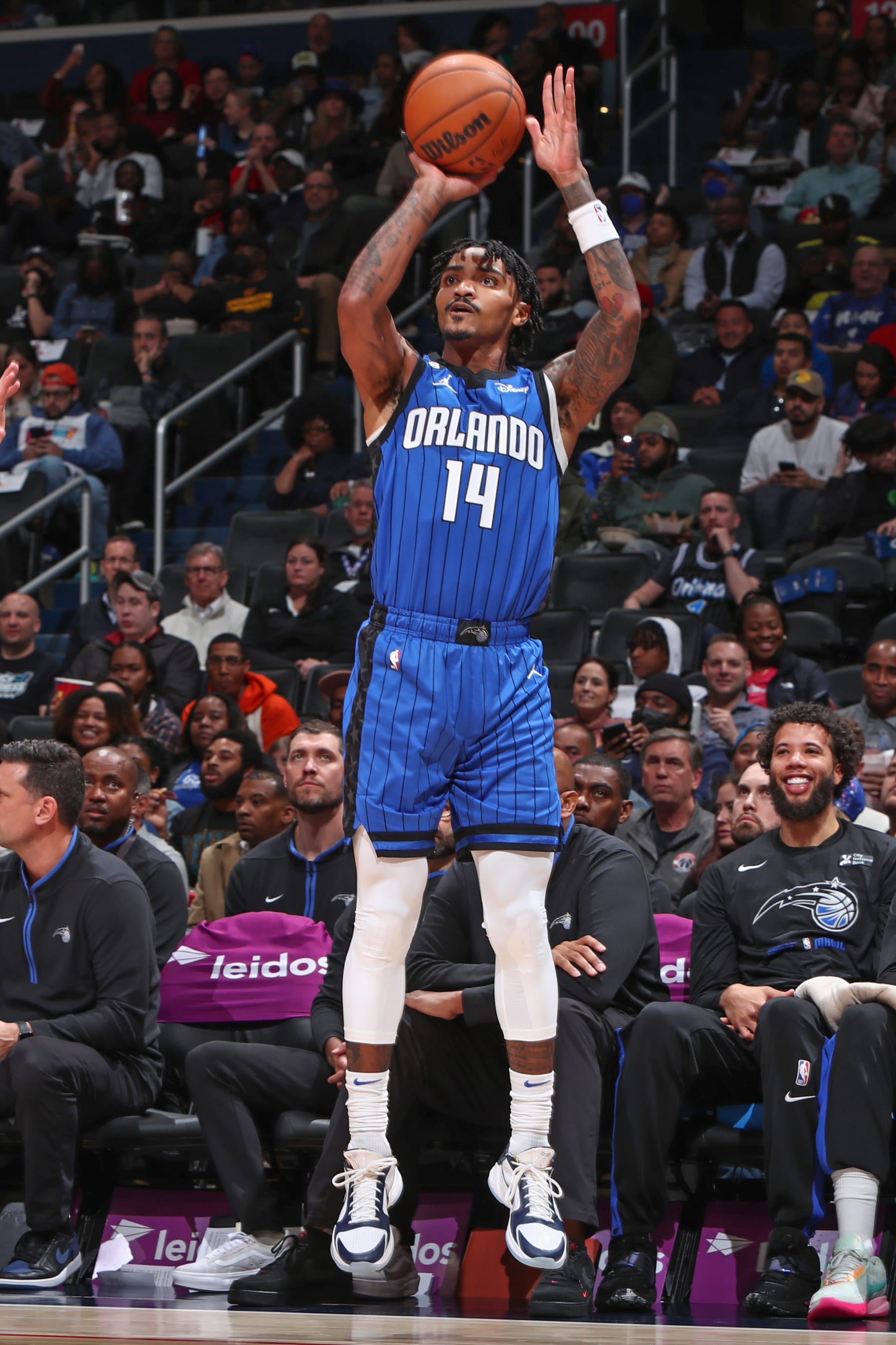 WASHINGTON, DC -  MARCH 31:  Gary Harris #14 of the Orlando Magic shoots a three point basket during the game  on March 31, 2023 at Capital One Arena in Washington, DC. NOTE TO USER: User expressly acknowledges and agrees that, by downloading and or using this Photograph, user is consenting to the terms and conditions of the Getty Images License Agreement. Mandatory Copyright Notice: Copyright 2023 NBAE (Photo by Kenny Giarla/NBAE via Getty Images)