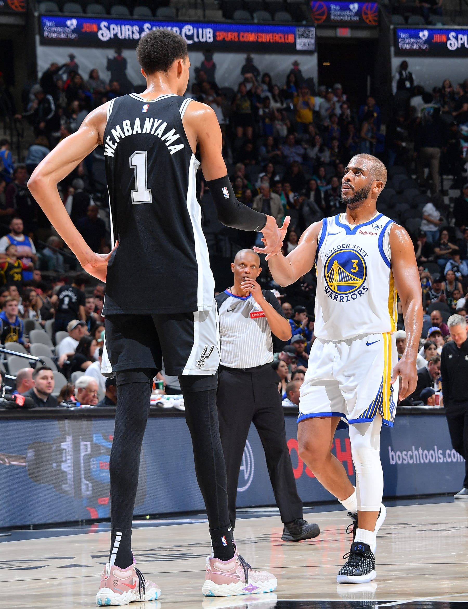 SAN ANTONIO, TX - MARCH 11: Victor Wembanyama #1 of the San Antonio Spurs and Chris Paul #3 of the Golden State Warriors shake hands after the game on March 11, 2024 at the Frost Bank Center in San Antonio, Texas. NOTE TO USER: User expressly acknowledges and agrees that, by downloading and or using this photograph, user is consenting to the terms and conditions of the Getty Images License Agreement. Mandatory Copyright Notice: Copyright 2024 NBAE (Photos by Michael Gonzales/NBAE via Getty Images) SAN ANTONIO, TX - MARCH 11: Victor Wembanyama #1 of the San Antonio Spurs and Chris Paul #3 of the Golden State Warriors shake hands after the game on March 11, 2024 at the Frost Bank Center in San Antonio, Texas. NOTE TO USER: User expressly acknowledges and agrees that, by downloading and or using this photograph, user is consenting to the terms and conditions of the Getty Images License Agreement. Mandatory Copyright Notice: Copyright 2024 NBAE (Photos by Michael Gonzales/NBAE via Getty Images)