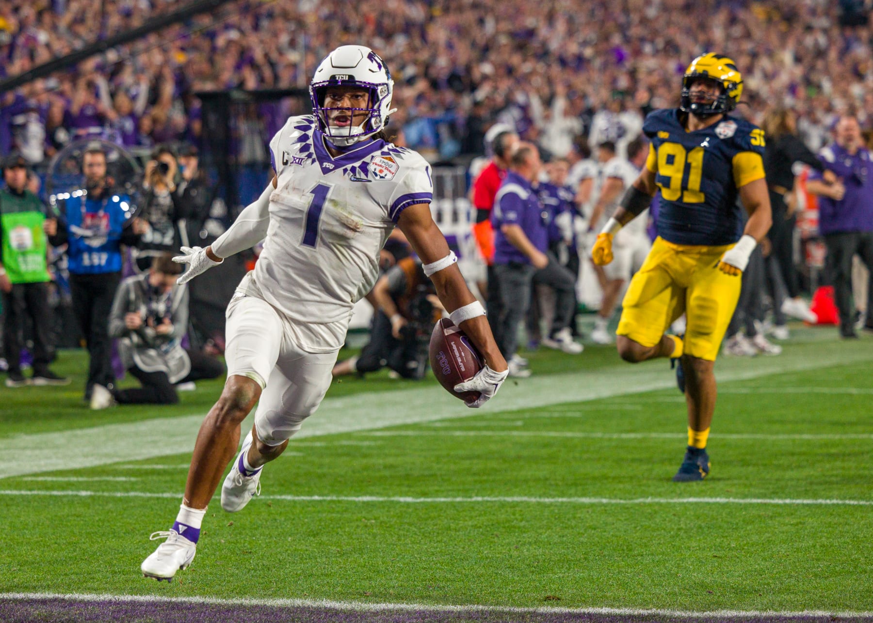 GLENDALE, AZ - DECEMBER 31: TCU Horned Frogs wide receiver Quentin Johnston (1) runs the ball into the end zone for a touchdown during the Vrbo Fiesta Bowl between the Michigan Wolverines and the TCU Horned Frogs on Saturday, December 31st, 2022 at State Farm Stadium in Glendale, AZ (Photo by Adam Bow/Icon Sportswire via Getty Images)