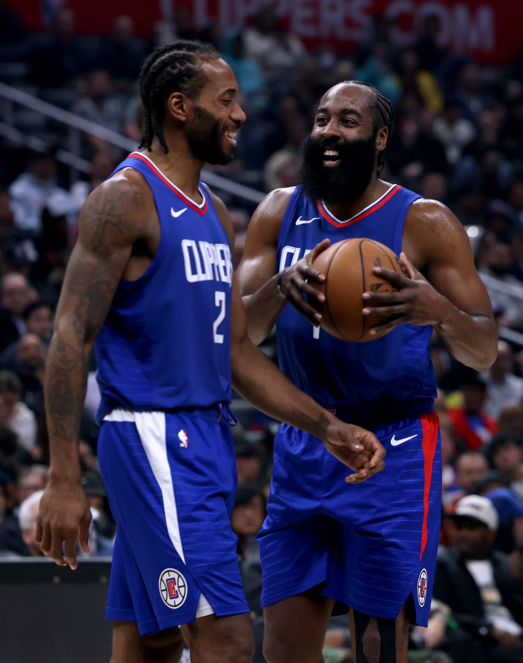 LOS ANGELES, CALIFORNIA - DECEMBER 12: James Harden #1 of the LA Clippers and Kawhi Leonard #2 laugh after a Sacramento Kings foul during the first half at Crypto.com Arena on December 12, 2023 in Los Angeles, California.  NOTE TO USER: User expressly acknowledges and agrees that, by downloading and or using this photograph, User is consenting to the terms and conditions of the Getty Images License Agreement. (Photo by Harry How/Getty Images)