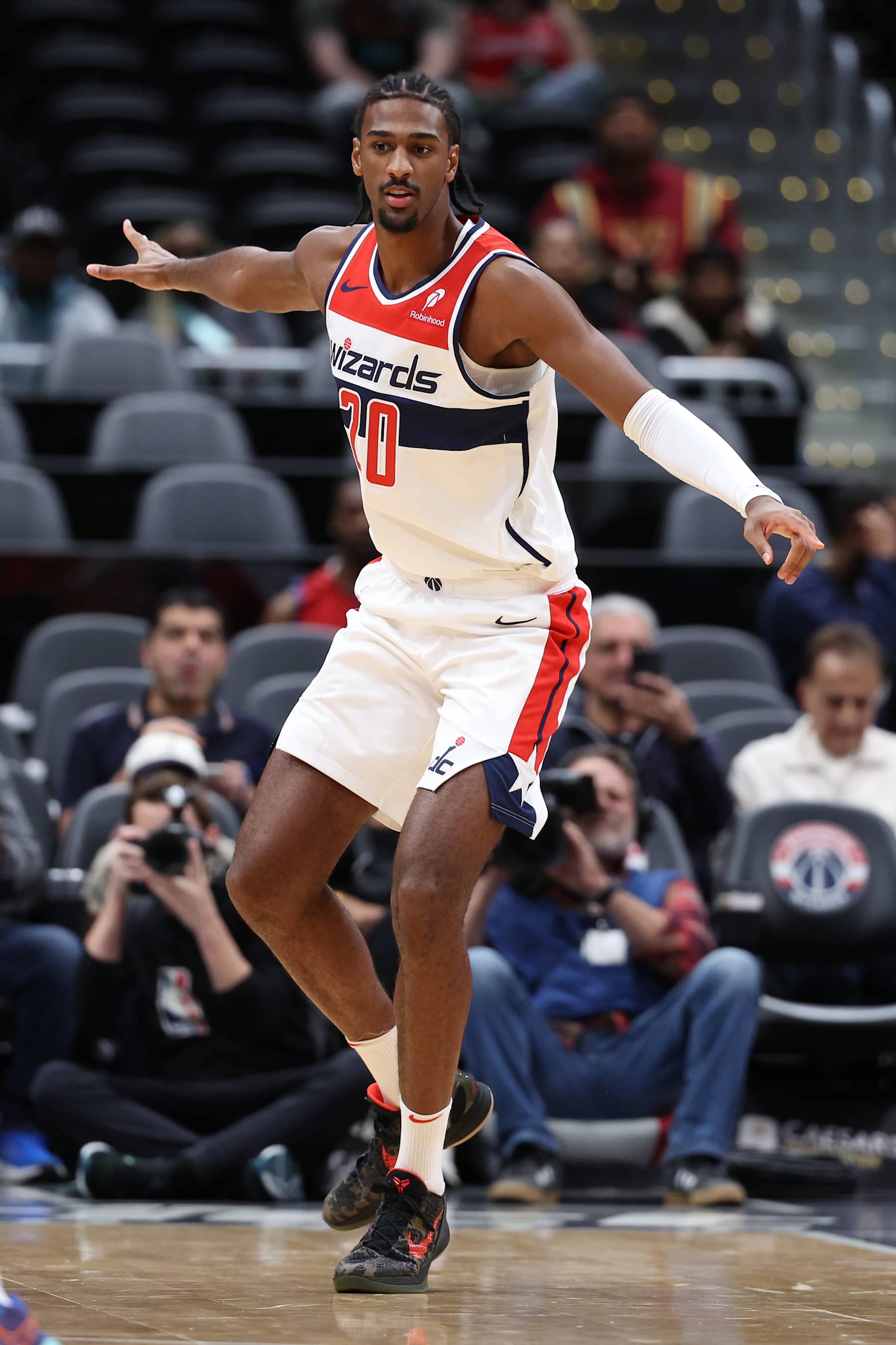 WASHINGTON, DC - OCTOBER 11: Alex Sarr #20 of the Washington Wizards plays defense against the Toronto Raptors during the first half of a preseason game at Capital One Arena on October 11, 2024 in Washington, DC. NOTE TO USER: User expressly acknowledges and agrees that, by downloading and or using this photograph, User is consenting to the terms and conditions of the Getty Images License Agreement. (Photo by Patrick Smith/Getty Images)