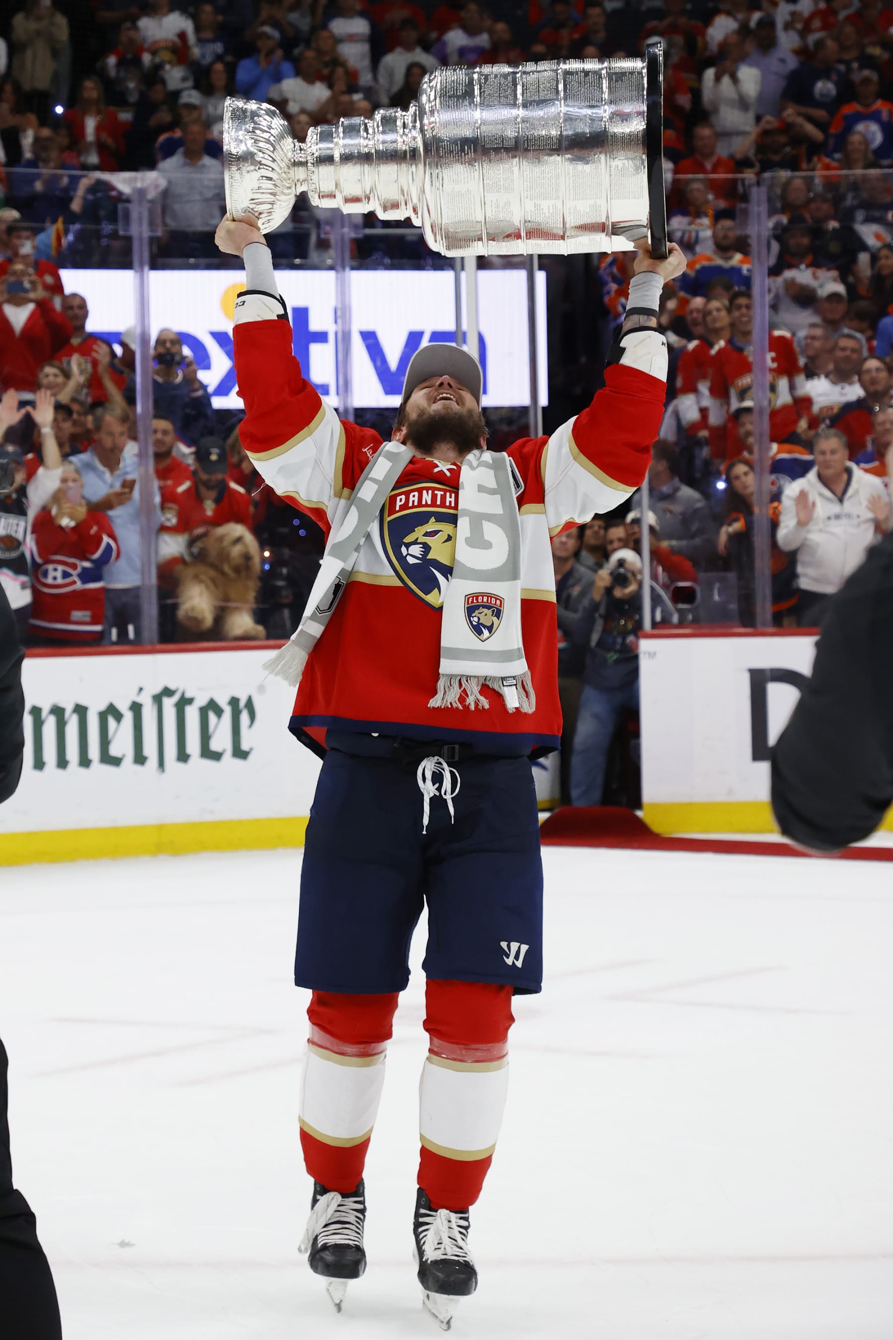 SUNRISE, FLORIDA - JUNE 24: Dmitry Kulikov #7 of the Florida Panthers hoists the Stanley Cup after a 2-1 victory over the Edmonton Oilers in Game Seven of the Stanley Cup Final at the Amerant Bank Arena on June 24, 2024 in Sunrise, Florida. (Photo by Eliot J. Schechter/NHLI via Getty Images)