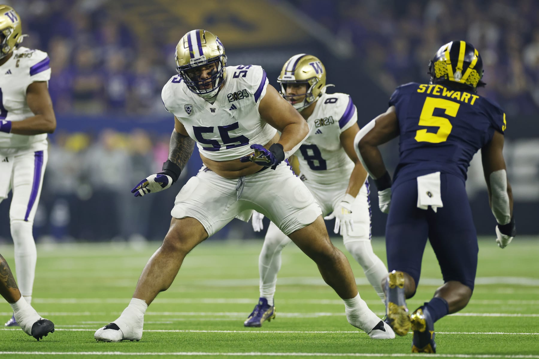 HOUSTON, TX - JANUARY 08: Washington Huskies offensive lineman Troy Fautanu (55) blocks during the CFP National Championship against the Michigan Wolverines on January 08, 2024 at NRG Stadium in Houston, Texas. (Photo by Joe Robbins/Icon Sportswire via Getty Images)