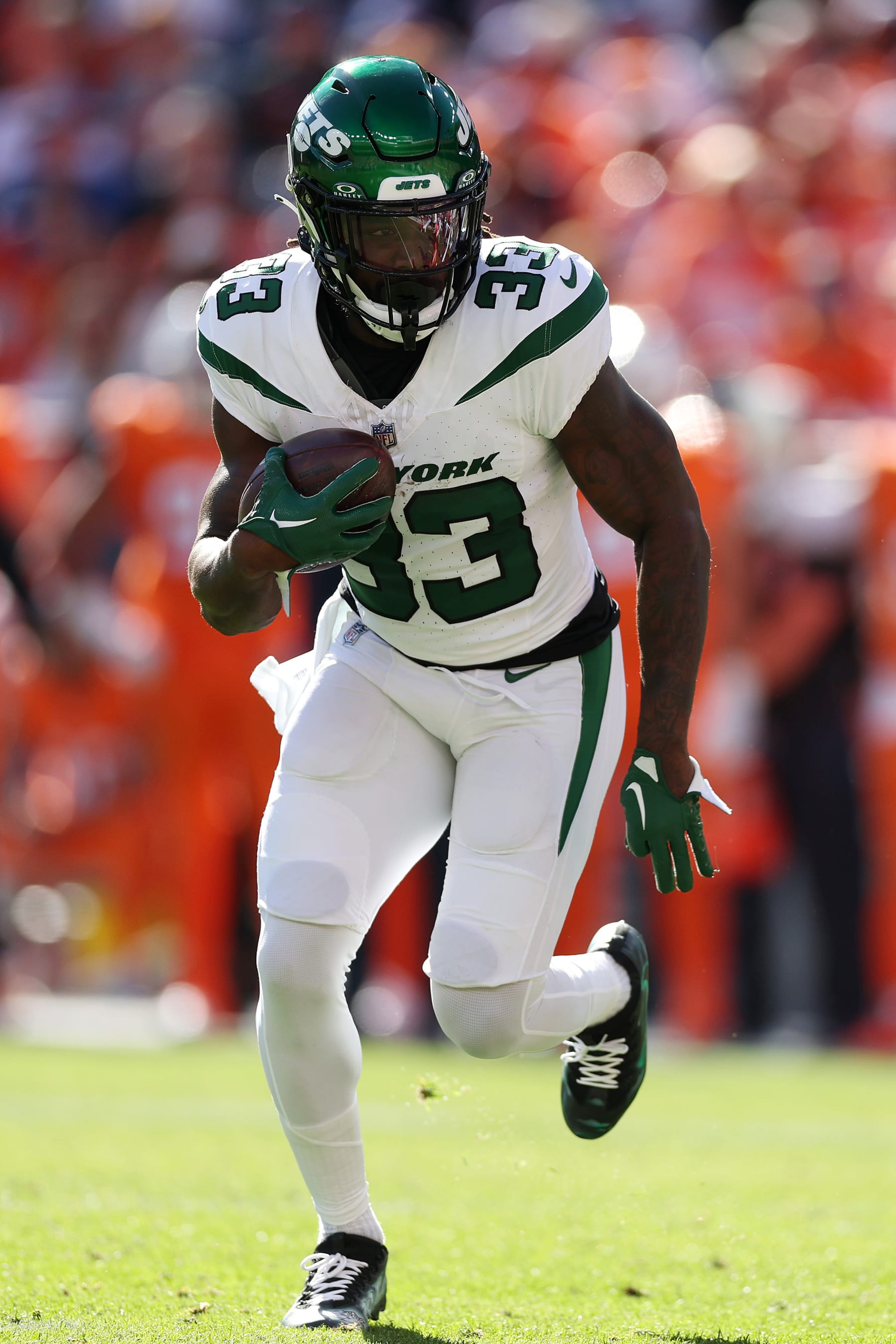 DENVER, COLORADO - OCTOBER 08: Dalvin Cook #33 of the New York Jets runs with the ball in the second quarter against the Denver Broncos at Empower Field At Mile High on October 08, 2023 in Denver, Colorado. (Photo by Matthew Stockman/Getty Images)