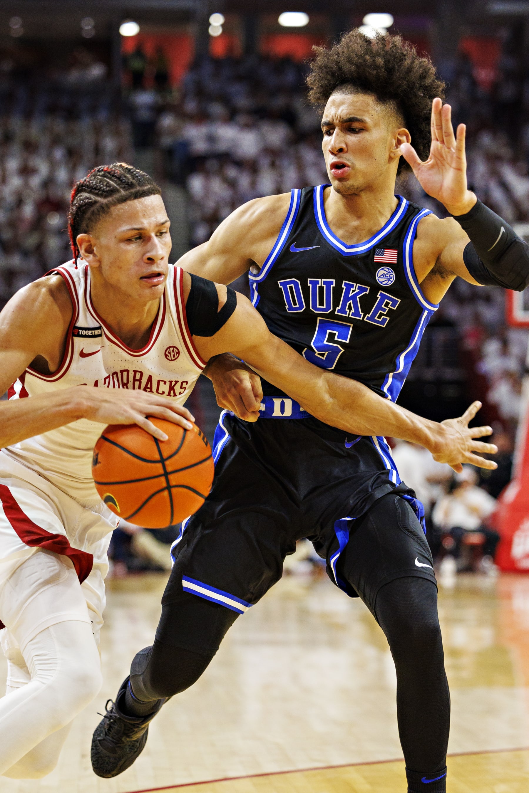 FAYETTEVILLE, ARKANSAS - NOVEMBER 29: Trevon Brazile #2 of the Arkansas Razorbacks drives to the basket during the first half against Tyrese Proctor #5 of the Duke Blue Devils at Bud Walton Arena on November 29, 2023 in Fayetteville, Arkansas. (Photo by Wesley Hitt/Getty Images)