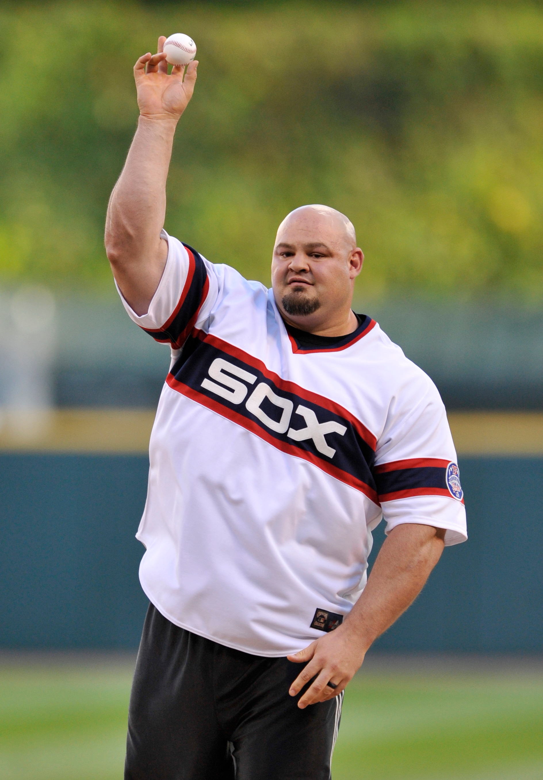 Brian Shaw, winner of the world's strongest man competition throws out the ceremonial first pitch before a baseball game between the Chicago White Sox and Kansas City Royals Saturday, Sept. 10, 2016, in Chicago. (AP Photo/Paul Beaty)