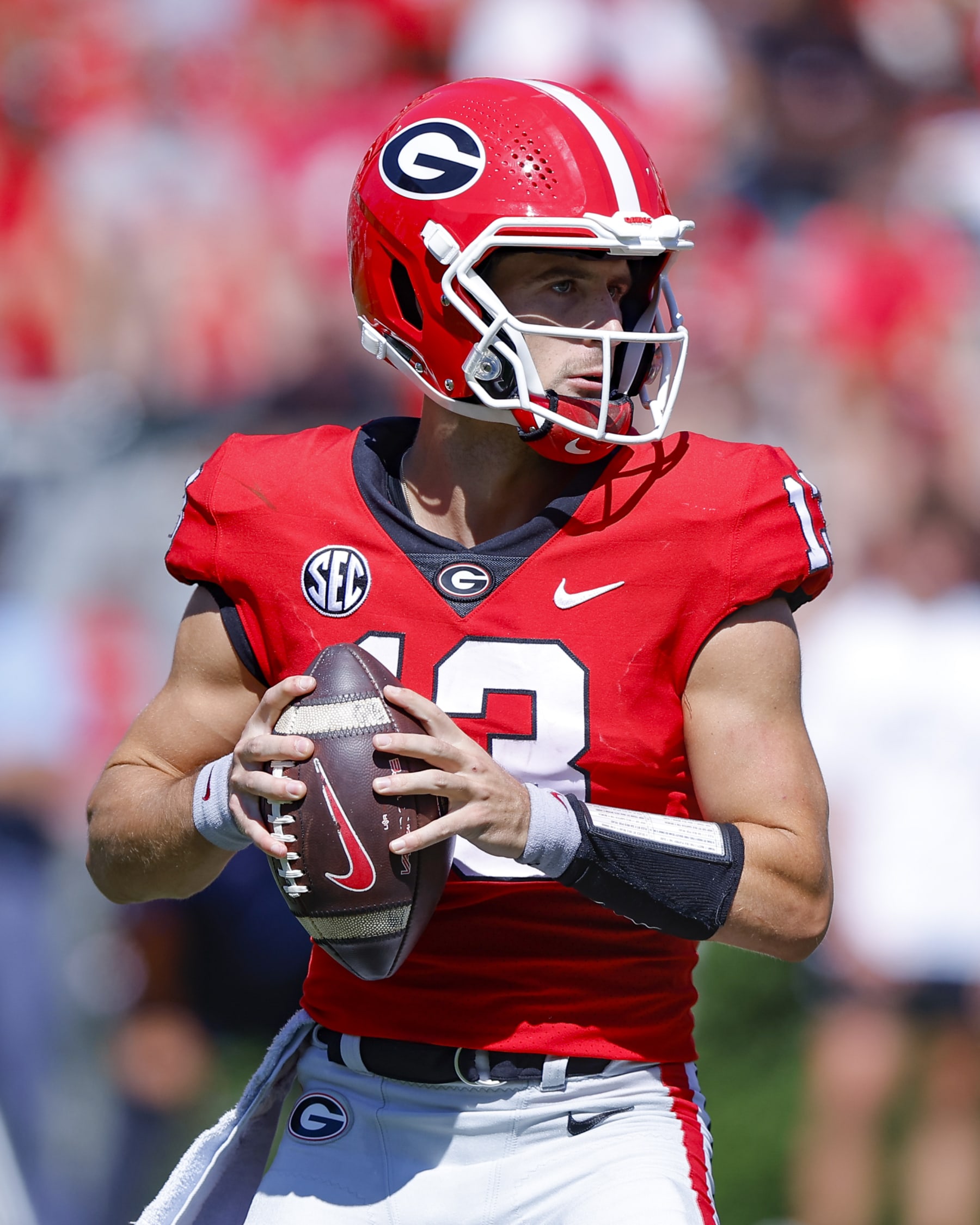 ATHENS, GA - SEPTEMBER 24: Stetson Bennett #13 of the Georgia Bulldogs drops back to pass during the second half against the Kent State Golden Flashes at Sanford Stadium on September 24, 2022 in Athens, Georgia. (Photo by Todd Kirkland/Getty Images)