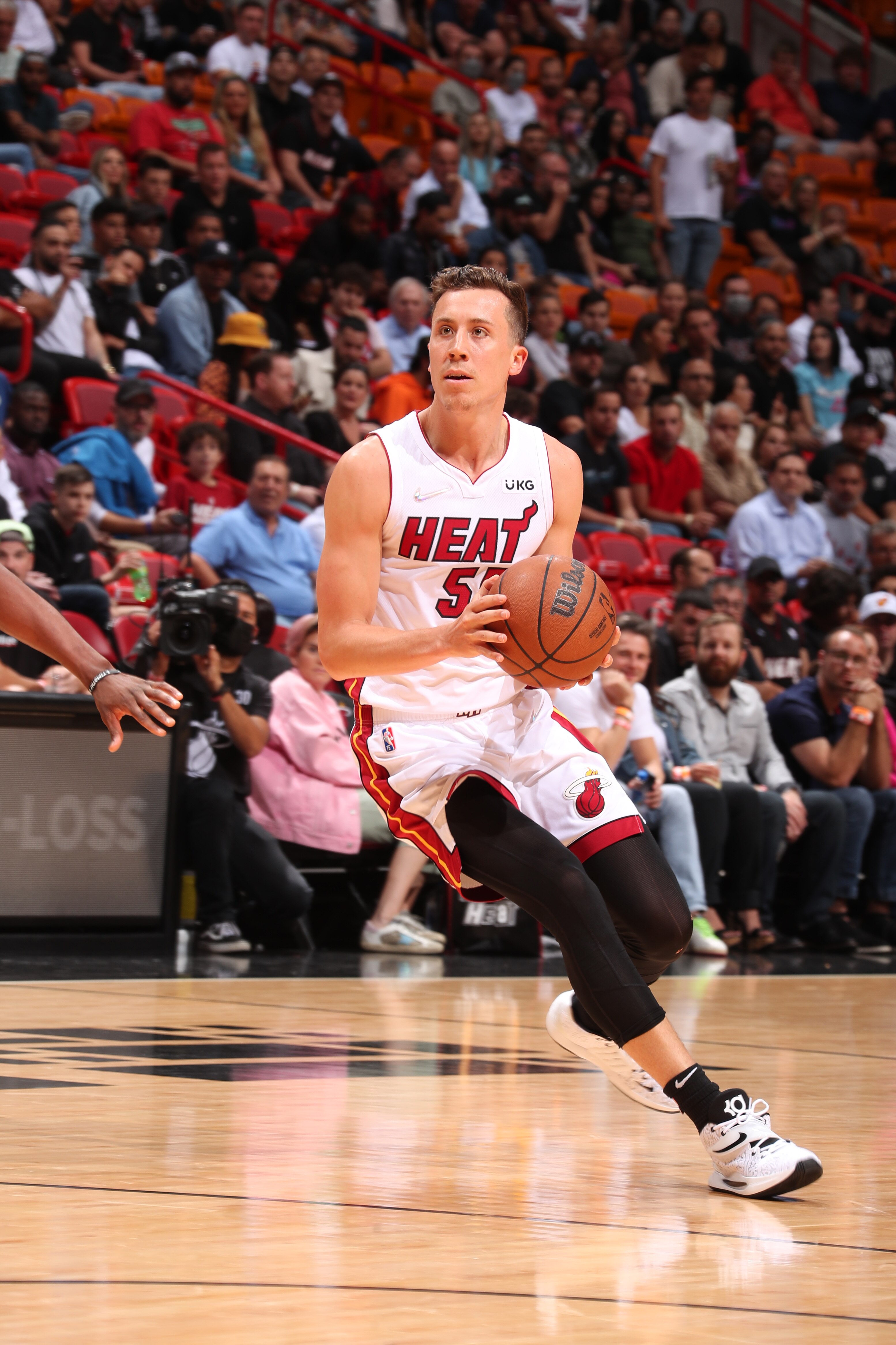 MIAMI, FL - MARCH 28: Duncan Robinson #55 of the Miami Heat handles the ball during the game against the Sacramento Kings on March 28, 2022 at FTX Arena in Miami, Florida. NOTE TO USER: User expressly acknowledges and agrees that, by downloading and or using this Photograph, user is consenting to the terms and conditions of the Getty Images License Agreement. Mandatory Copyright Notice: Copyright 2022 NBAE (Photo by Issac Baldizon/NBAE via Getty Images)