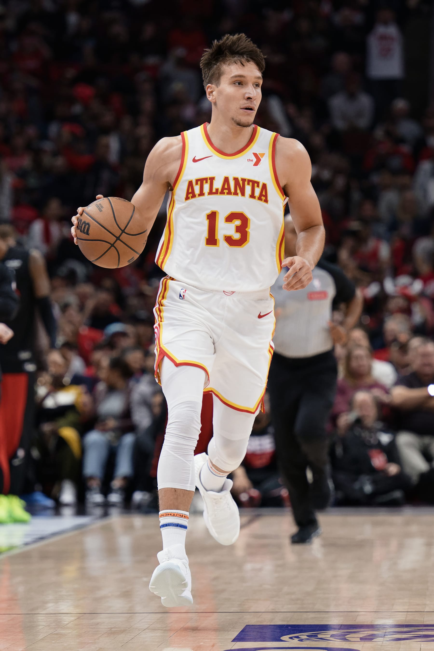 CHICAGO, ILLINOIS - APRIL 17:  Bogdan Bogdanovic #13 of the Atlanta Hawks controls the ball against the Chicago Bulls on April 17, 2024 at United Center in Chicago, Illinois.   NOTE TO USER: User expressly acknowledges and agrees that, by downloading and or using this photograph, User is consenting to the terms and conditions of the Getty Images License Agreement.  (Photo by Jamie Sabau/Getty Images)