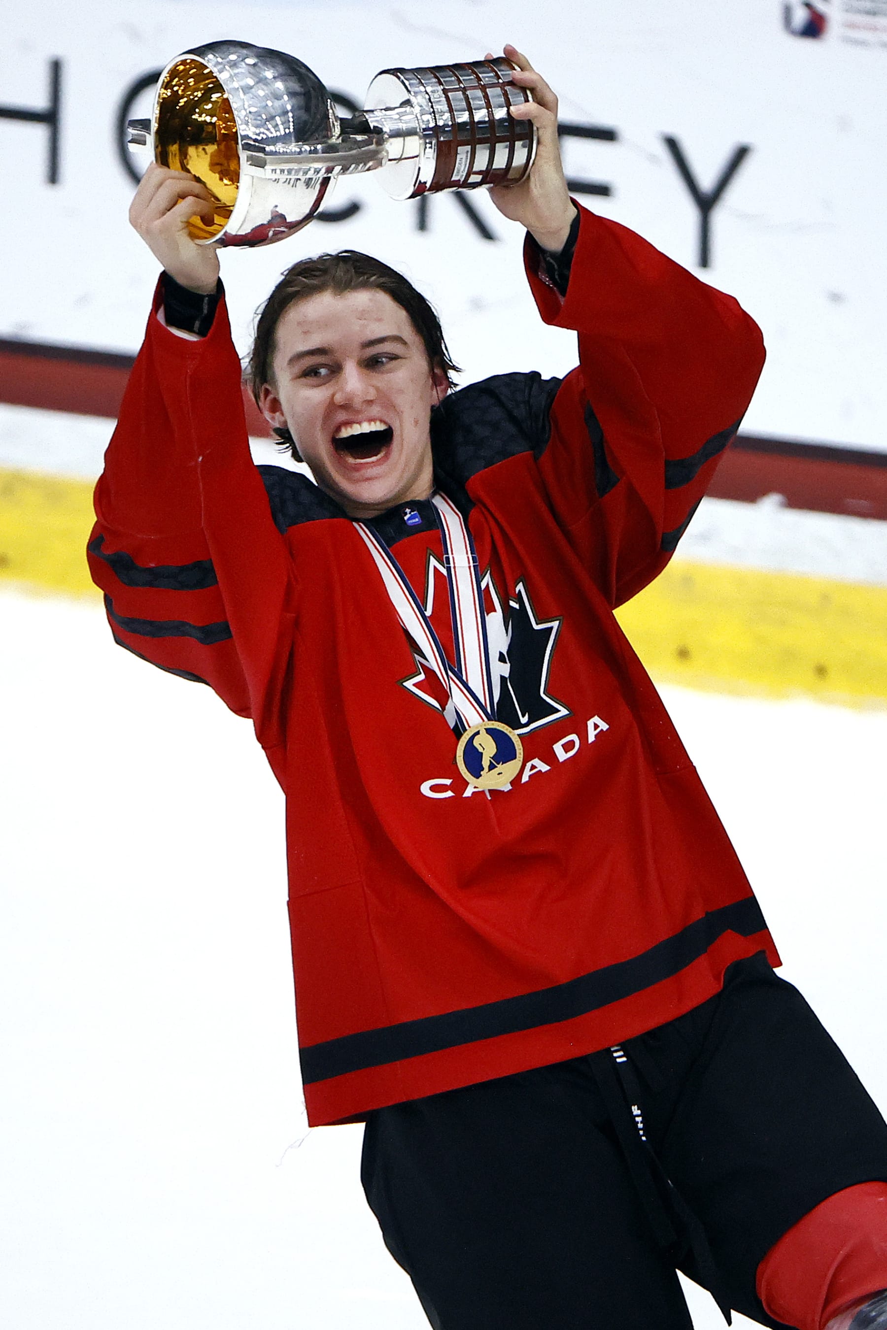 FRISCO, TEXAS - MAY 06: Connor Bedard #17 of Canada celebrates with the championship trophy after defeating Russia 5-3 in the 2021 IIHF Ice Hockey U18 World Championship Gold Medal Game at Comerica Center on May 06, 2021 in Frisco, Texas. (Photo by Tom Pennington/Getty Images)