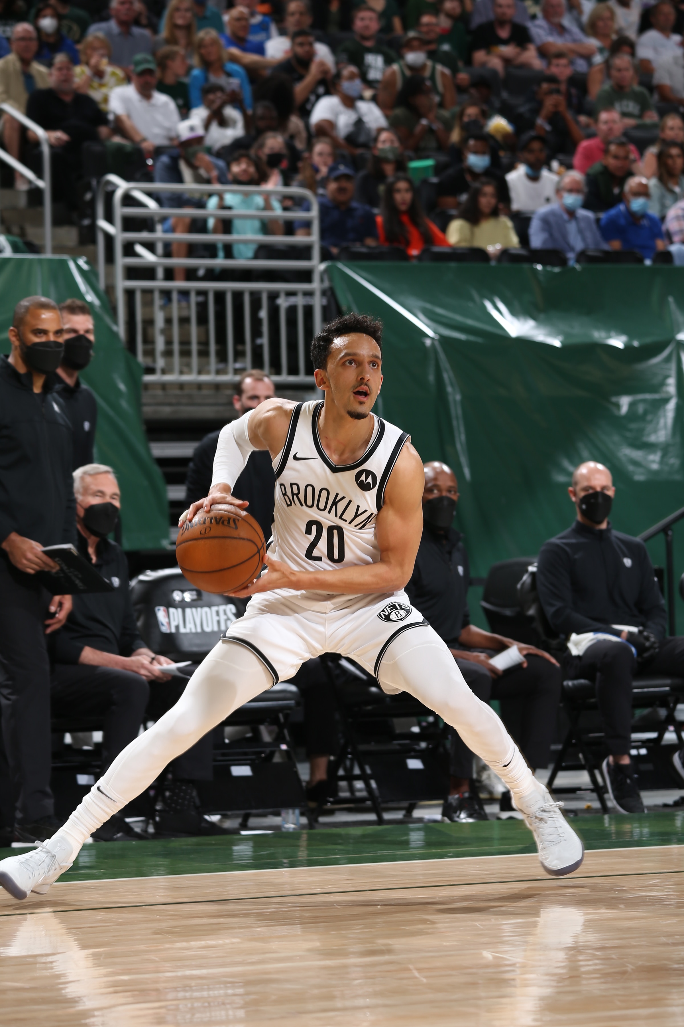 MILWAUKEE, WI - JUNE 17: Landry Shamet #20 of the Brooklyn Nets looks to shoot the ball against the Milwaukee Bucks during Round 2, Game 6 of the 2021 NBA Playoffs on June 17, 2021 at the Fiserv Forum Center in Milwaukee, Wisconsin. NOTE TO USER: User expressly acknowledges and agrees that, by downloading and or using this Photograph, user is consenting to the terms and conditions of the Getty Images License Agreement. Mandatory Copyright Notice: Copyright 2021 NBAE (Photo by Gary Dineen/NBAE via Getty Images).