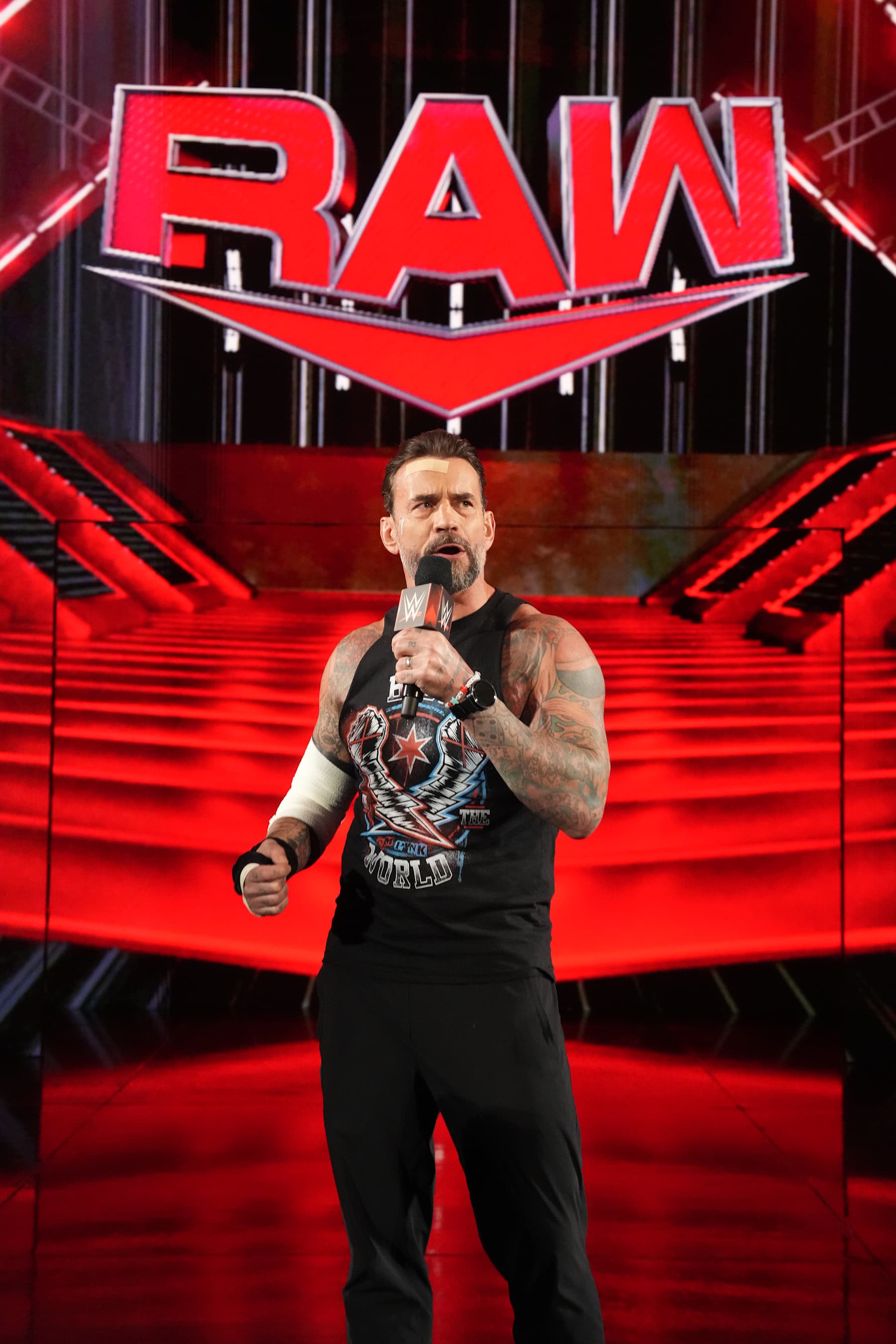 ST LOUIS, MISSOURI - OCTOBER 07: CM Punk addresses the crowd during Monday Night RAW at Enterprise Center on October 7, 2024 in St Louis, Missouri. (Photo by WWE/Getty Images) ST LOUIS, MISSOURI - OCTOBER 07: CM Punk addresses the crowd during Monday Night RAW at Enterprise Center on October 7, 2024 in St Louis, Missouri. (Photo by WWE/Getty Images)