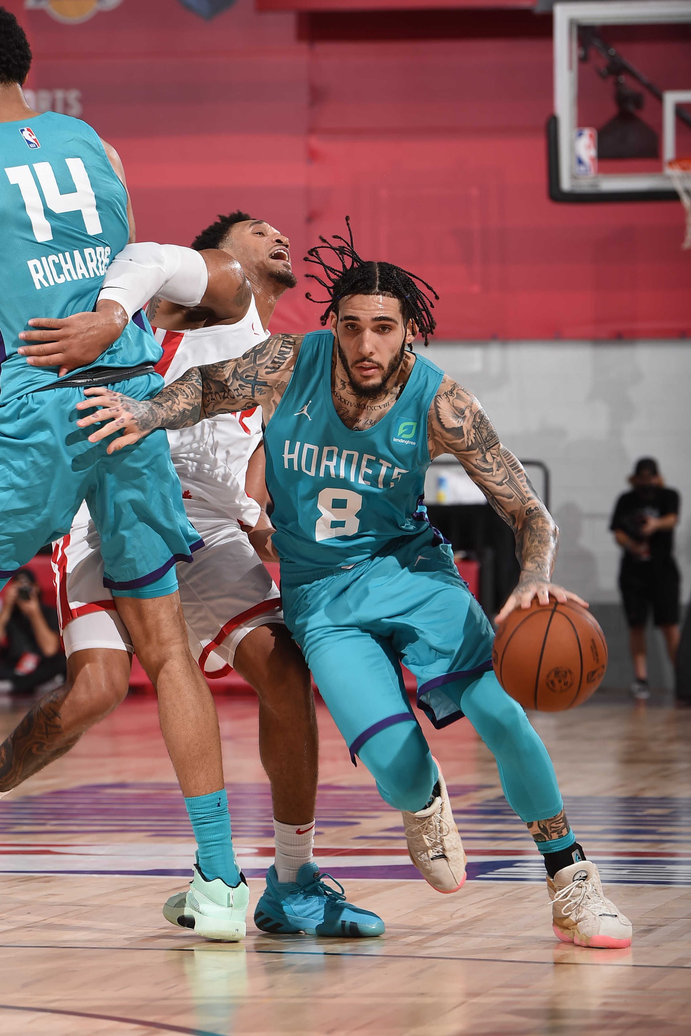 LAS VEGAS, NV - AUGUST 14: LiAngelo Ball #8 of Charlotte Hornets dribbles the ball against the Toronto Raptors during the 2021 Las Vegas Summer League on August 14, 2021 at the Cox Pavilion in Las Vegas, Nevada. NOTE TO USER: User expressly acknowledges and agrees that, by downloading and/or using this Photograph, user is consenting to the terms and conditions of the Getty Images License Agreement. Mandatory Copyright Notice: Copyright 2021 NBAE (Photo by David Dow/NBAE via Getty Images)