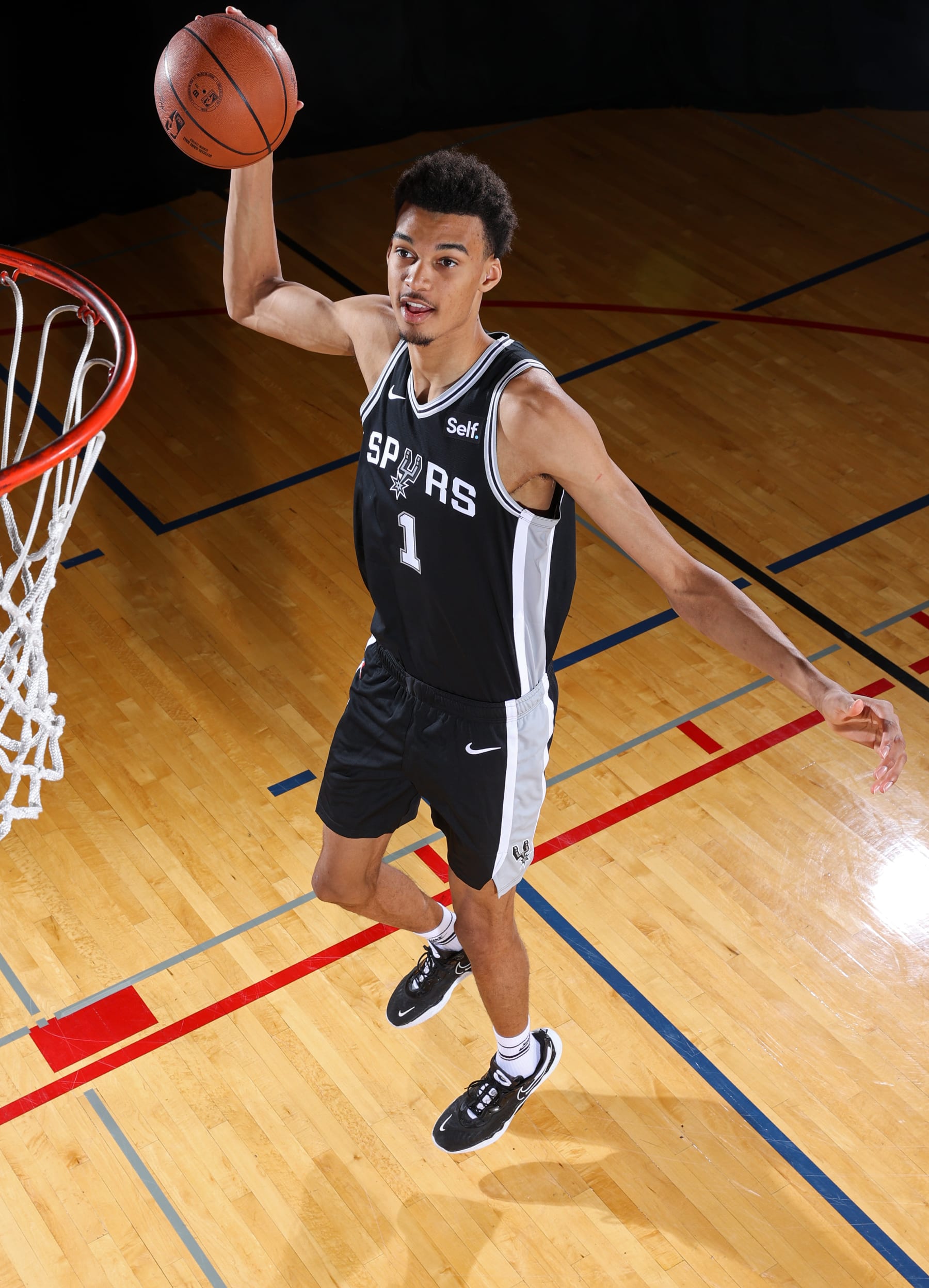 LAS VEGAS, NV - JULY12: Victor Wembanyama #1 of the San Antonio Spurs poses for a portrait during the 2023 NBA Rookie Photo Shoot on July 12, 2023 at the University of Nevada, Las Vegas campus in Las Vegas, Nevada. NOTE TO USER: User expressly acknowledges and agrees that, by downloading and/or using this Photograph, user is consenting to the terms and conditions of the Getty Images License Agreement. Mandatory Copyright Notice: Copyright 2023 NBAE (Photo by Stephen Gosling/NBAE via Getty Images)