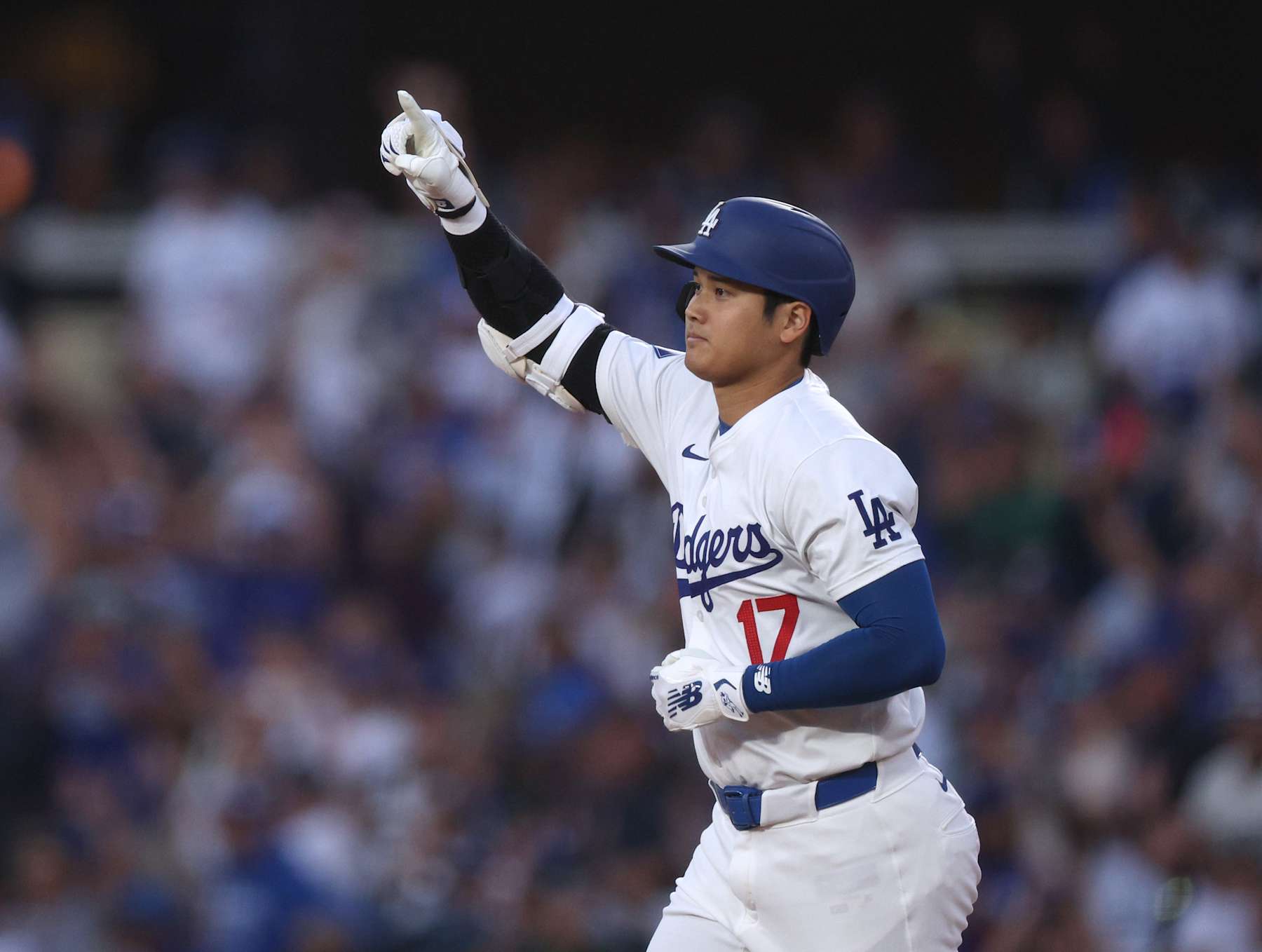 LOS ANGELES, CALIFORNIA - AUGUST 28: Shohei Ohtani #17 of the Los Angeles Dodgers reacts to his solo home run, his 42nd of the season, to take a 1-0 lead over the Baltimore Orioles, during the first inning at Dodger Stadium on August 28, 2024 in Los Angeles, California. (Photo by Harry How/Getty Images)