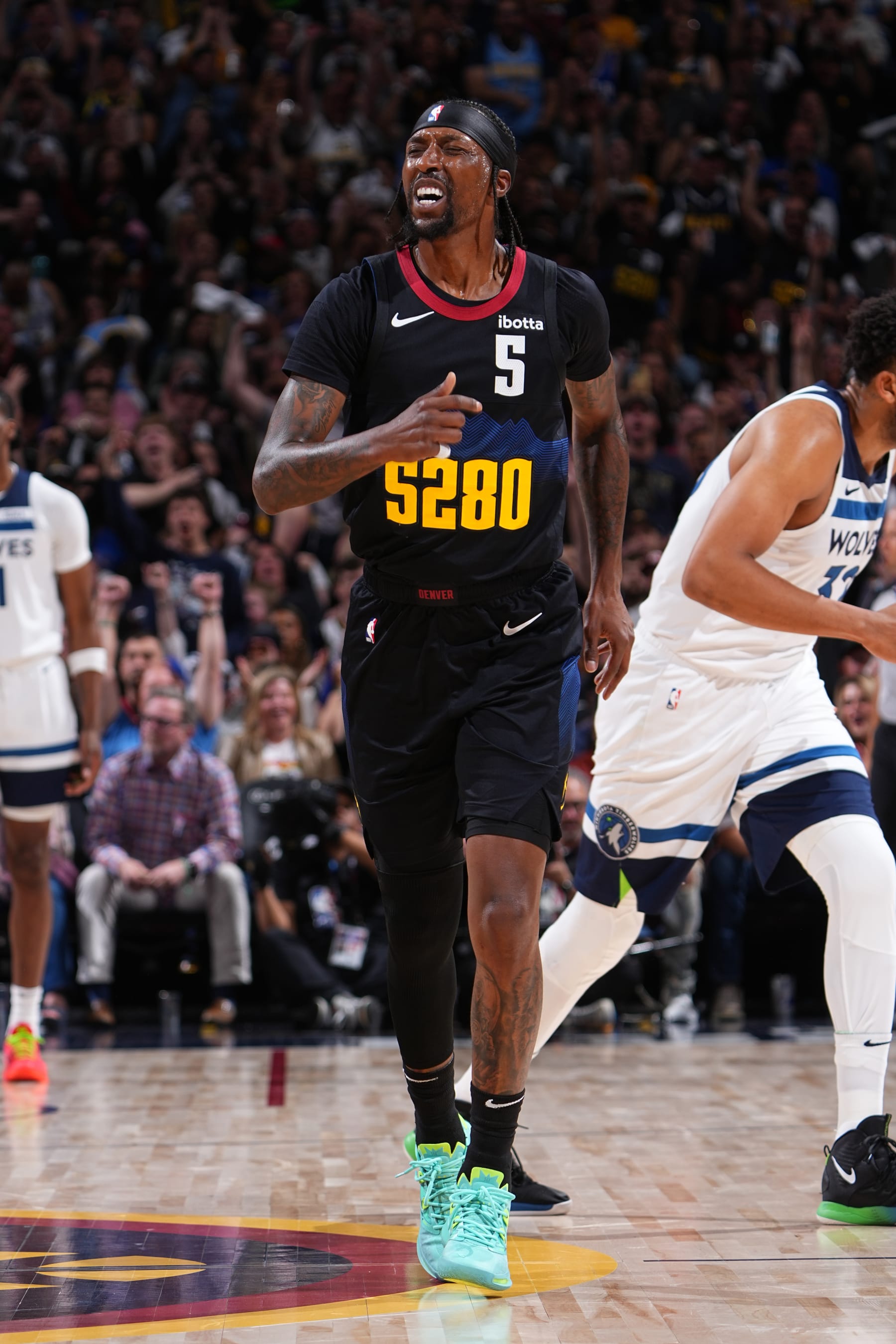DENVER, CO - MAY 14: Kentavious Caldwell-Pope #5 of the Denver Nuggets celebrates during the game against the Minnesota Timberwolves during Round 2 Game 5 of the of the 2024 NBA Playoffs on May 14, 2024 at the Ball Arena in Denver, Colorado. NOTE TO USER: User expressly acknowledges and agrees that, by downloading and/or using this Photograph, user is consenting to the terms and conditions of the Getty Images License Agreement. Mandatory Copyright Notice: Copyright 2024 NBAE (Photo by Garrett Ellwood/NBAE via Getty Images)