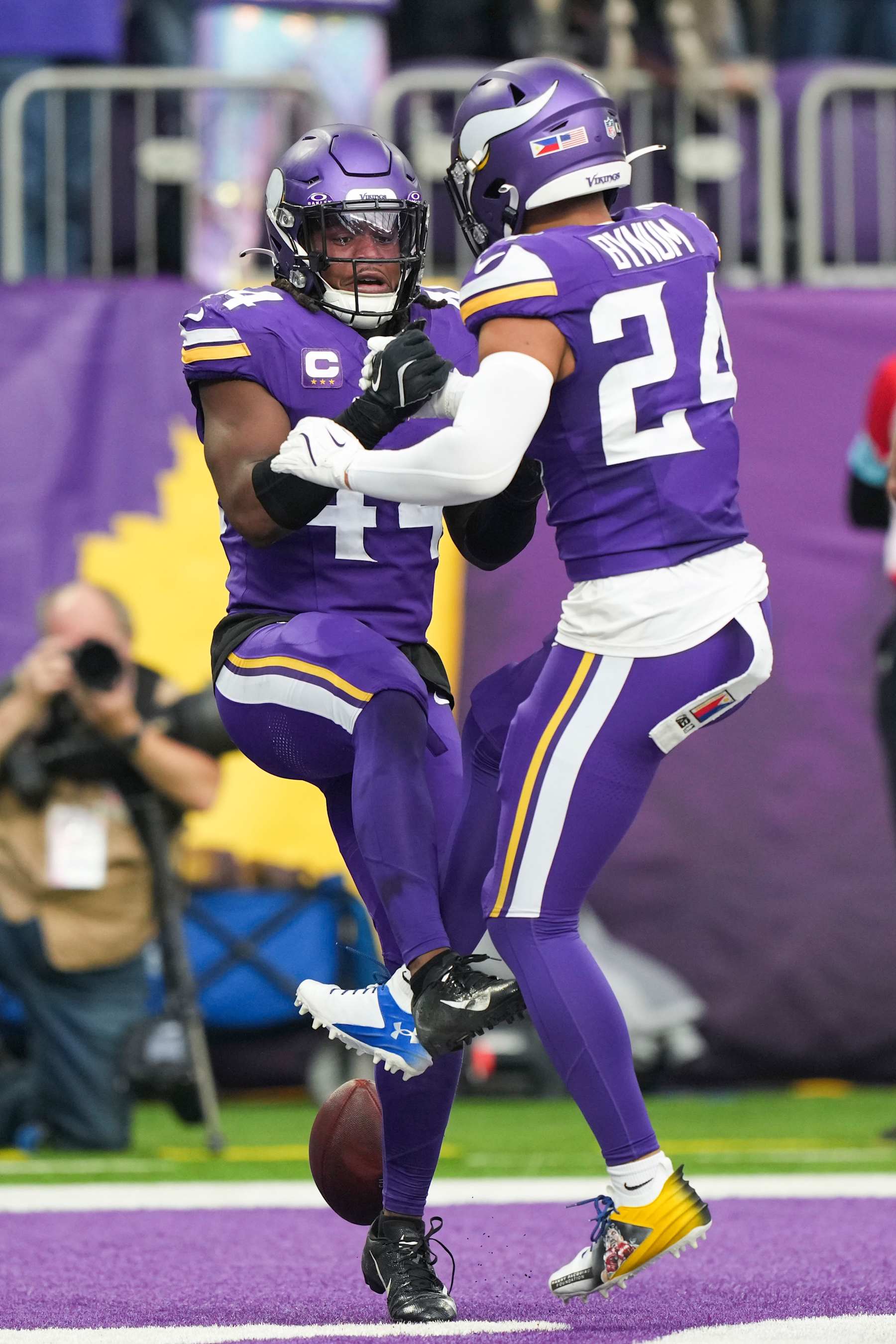 MINNEAPOLIS, MINNESOTA - DECEMBER 8: Safety Josh Metellus #44 of the Minnesota Vikings celebrates with safety Camryn Bynum #24 after an interception during the first half of an NFL football game against the Atlanta Falcons at U.S. Bank Stadium on December 8, 2024 in Minneapolis, MInnesota. (Photo by Todd Rosenberg/Getty Images)