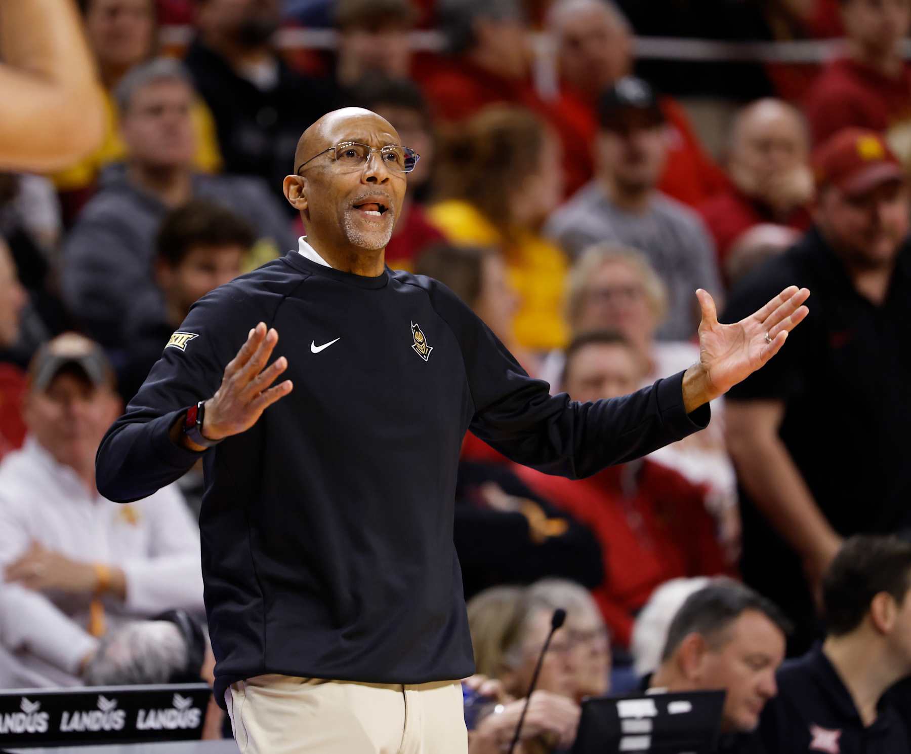 AMES, IA - JANUARY 21: Head coach Johnny Dawkins of the UCF Knights coaches from the bench in the first half of play at Hilton Coliseum on January 21, 2025, in Ames, Iowa. The Iowa State Cyclones won 108-83 over the UCF Knights. (Photo by David K Purdy/Getty Images) AMES, IA - JANUARY 21: Head coach Johnny Dawkins of the UCF Knights coaches from the bench in the first half of play at Hilton Coliseum on January 21, 2025, in Ames, Iowa. The Iowa State Cyclones won 108-83 over the UCF Knights. (Photo by David K Purdy/Getty Images)