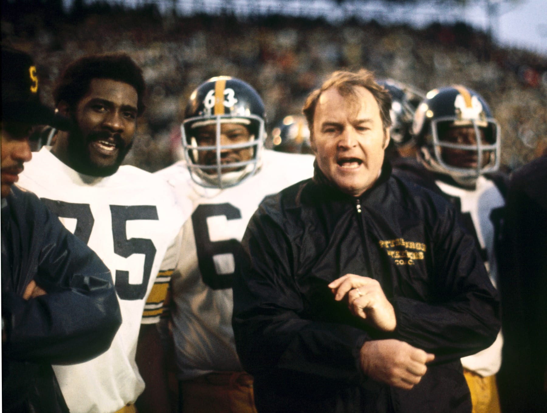 Pittsburgh head coach Chuck Noll with wide receiver coach Lionel Taylor, Hall of Fame defensive tackle Joe Greene and defensive tackle Ernie Holmes, during the closing seconds of the Steelers 16-6 win over the Minnesota Vikings in Super Bowl IX on January 12, 1975 at Tulane Stadium in New Orleans, Louisiana. (Photo by Sylvia Allen/Getty Images) *** Local Caption ***