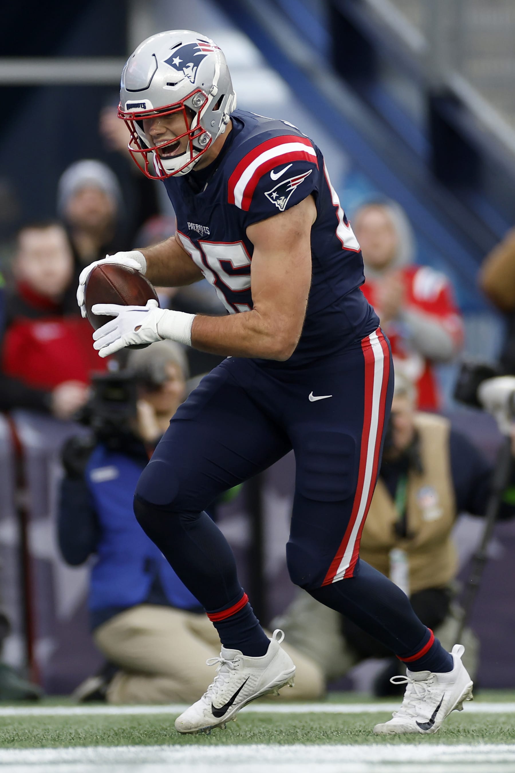 FOXBOROUGH, MASSACHUSETTS - DECEMBER 17: Hunter Henry #85 of the New England Patriots reacts after catching a touchdown during the second quarter against the Kansas City Chiefs at Gillette Stadium on December 17, 2023 in Foxborough, Massachusetts. (Photo by Sarah Stier/Getty Images)