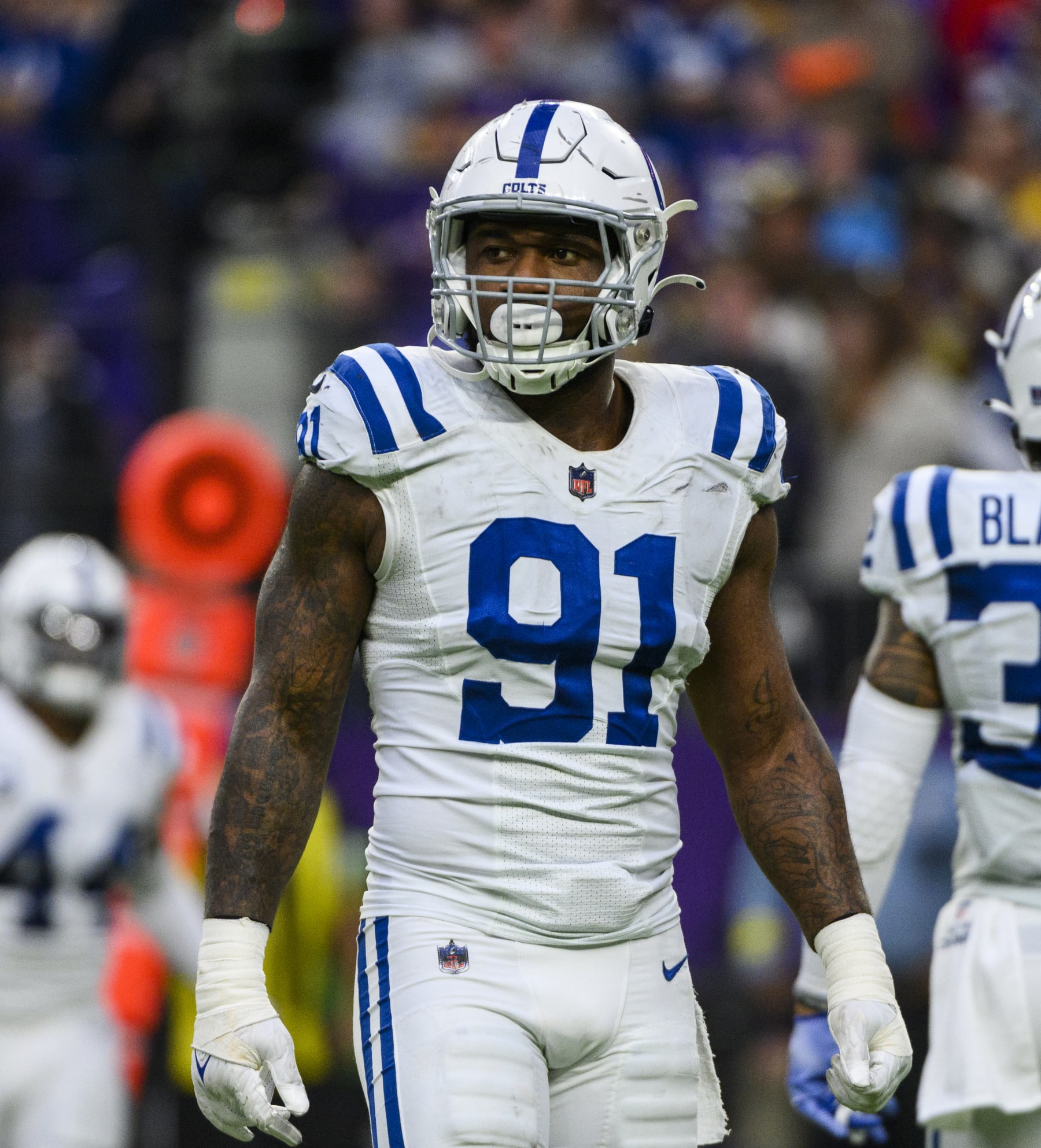 MINNEAPOLIS, MN - DECEMBER 17: Yannick Ngakoue #91 of the Indianapolis Colts stands between plays in the fourth quarter of the game against the Minnesota Vikings at U.S. Bank Stadium on December 17, 2022 in Minneapolis, Minnesota. (Photo by Stephen Maturen/Getty Images)