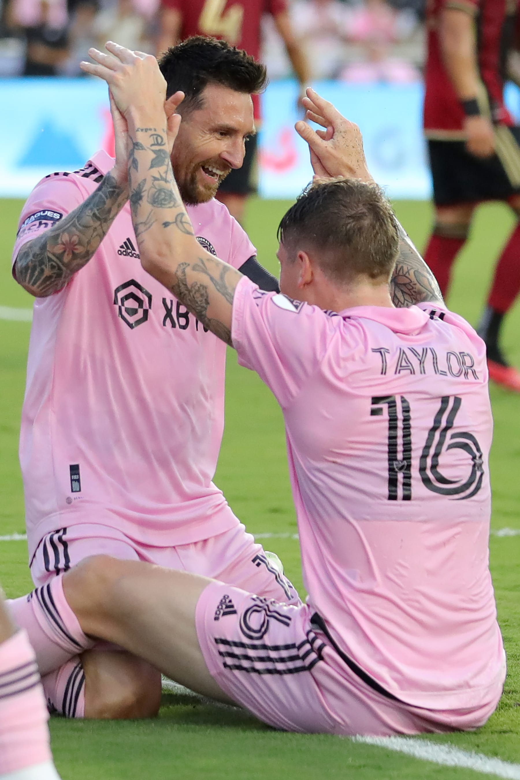 FORT LAUDERDALE, FLORIDA - JULY 25: Lionel Messi #10 of Inter Miami CF celebrates with Robert Taylor after scoring a goal in the first half during the Leagues Cup 2023 match between Inter Miami CF and Atlanta United at DRV PNK Stadium on July 25, 2023 in Fort Lauderdale, Florida. (Photo by Megan Briggs/Getty Images)