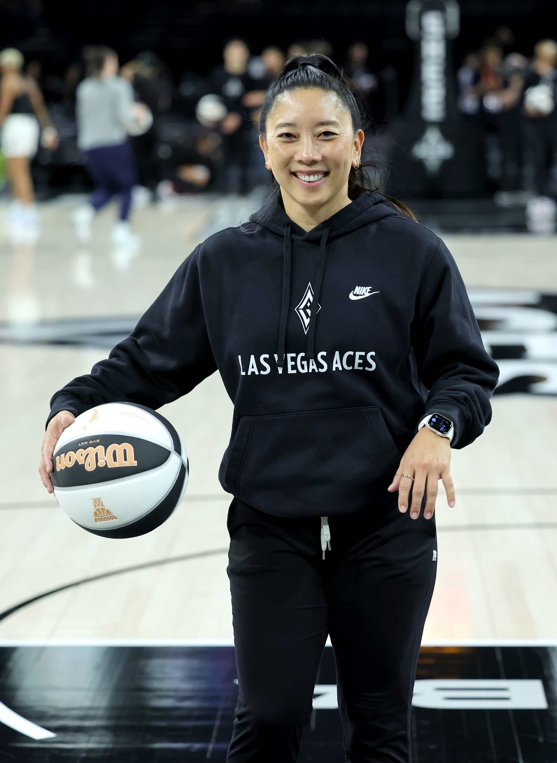 LAS VEGAS, NEVADA - JUNE 11: First assistant coach Natalie Nakase of the Las Vegas Aces warms up with players before a game against the Minnesota Lynx at Michelob ULTRA Arena on June 11, 2024 in Las Vegas, Nevada. NOTE TO USER: User expressly acknowledges and agrees that, by downloading and or using this photograph, User is consenting to the terms and conditions of the Getty Images License Agreement. (Photo by Ethan Miller/Getty Images)