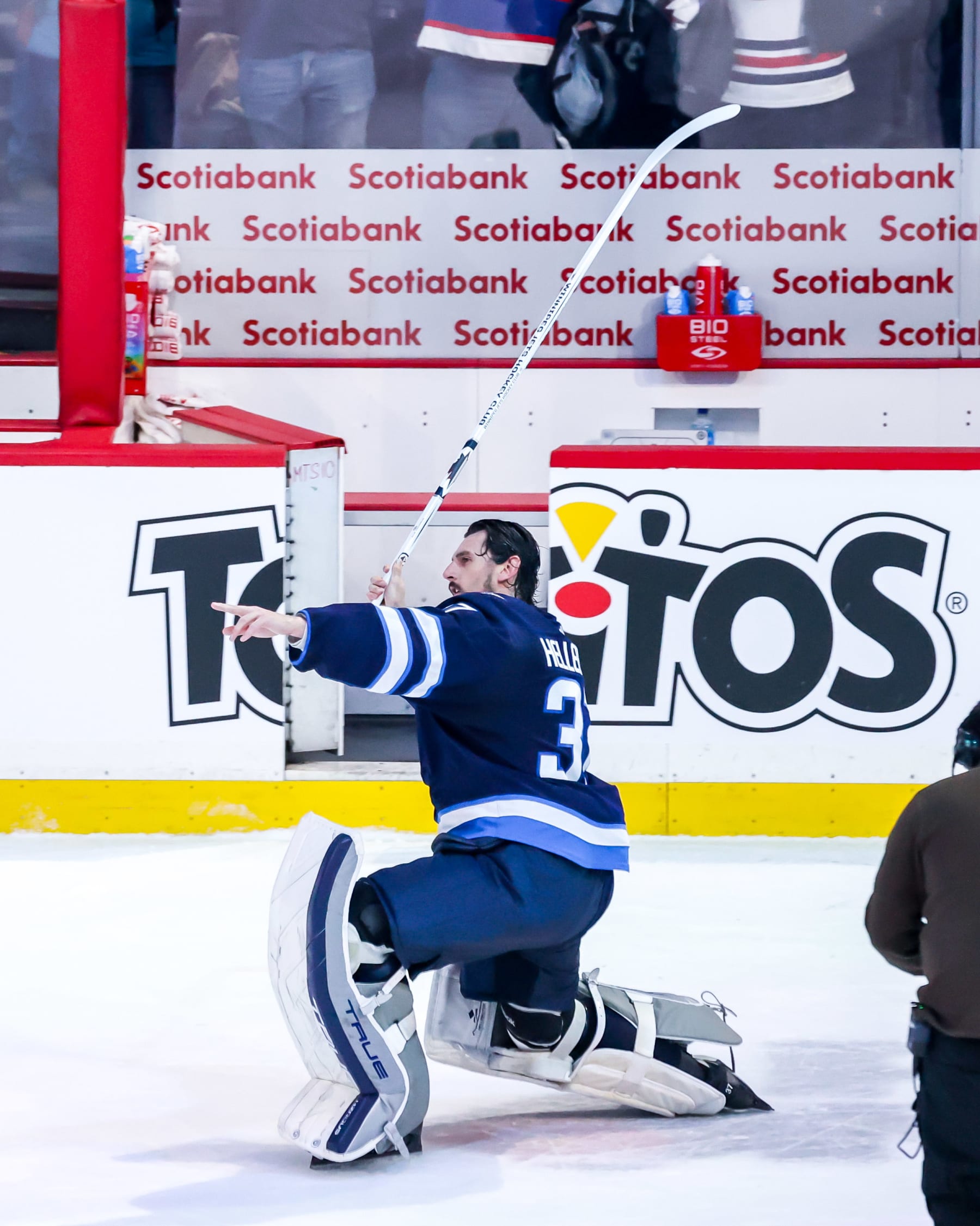 WINNIPEG, CANADA - JANUARY 9: Goaltender Connor Hellebuyck #37 of the Winnipeg Jets celebrates after receiving first star honours following a 5-0 shutout victory over the Columbus Blue Jackets at the Canada Life Centre on January 9, 2024 in Winnipeg, Manitoba, Canada. (Photo by Jonathan Kozub/NHLI via Getty Images)