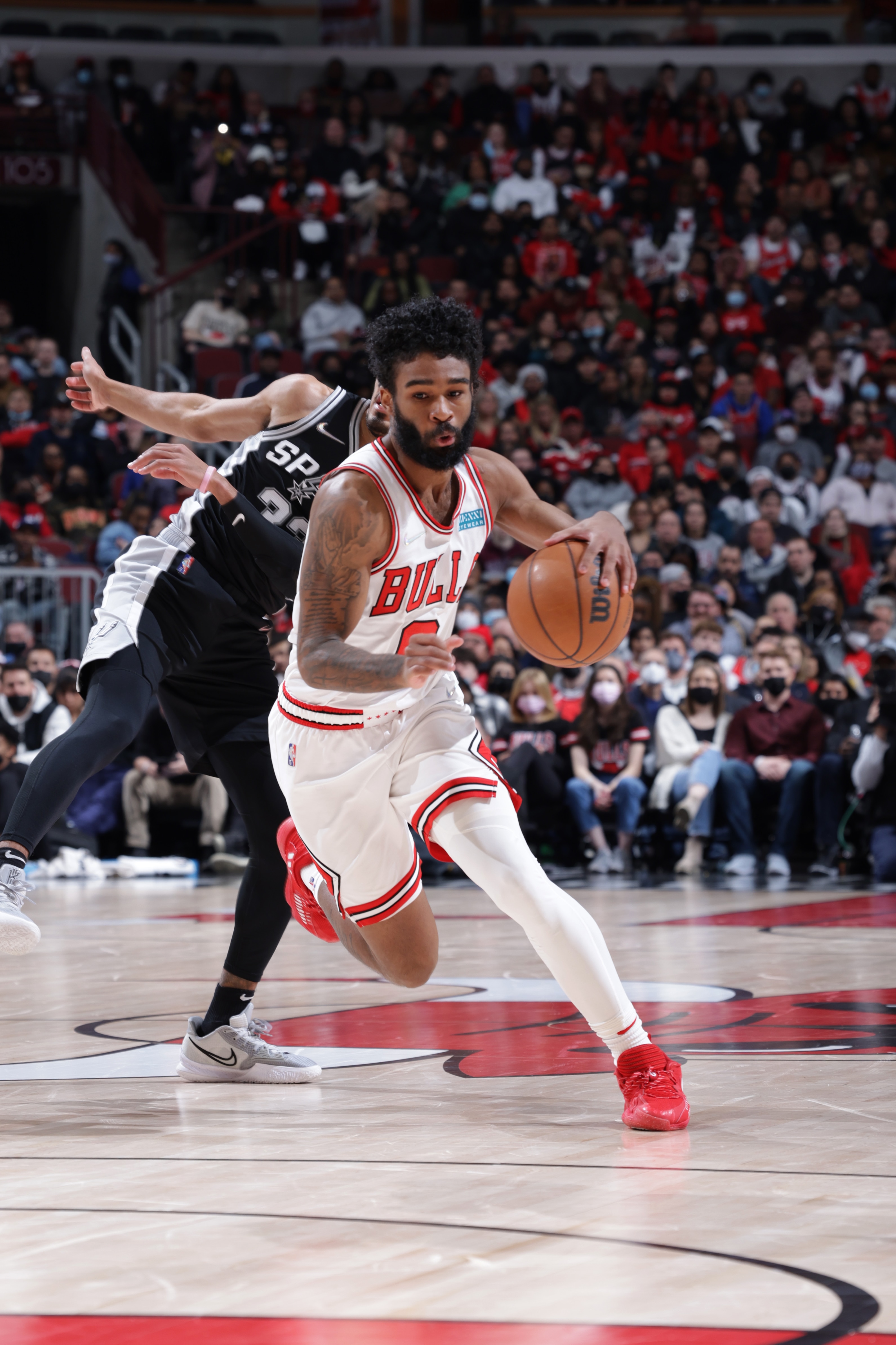 CHICAGO, IL - FEBRUARY 14: Coby White #0 of the Chicago Bulls drives to the basket during the game against the San Antonio Spurs on February 14, 2022 at United Center in Chicago, Illinois. NOTE TO USER: User expressly acknowledges and agrees that, by downloading and or using this photograph, User is consenting to the terms and conditions of the Getty Images License Agreement. Mandatory Copyright Notice: Copyright 2022 NBAE (Photo by Jeff Haynes/NBAE via Getty Images)