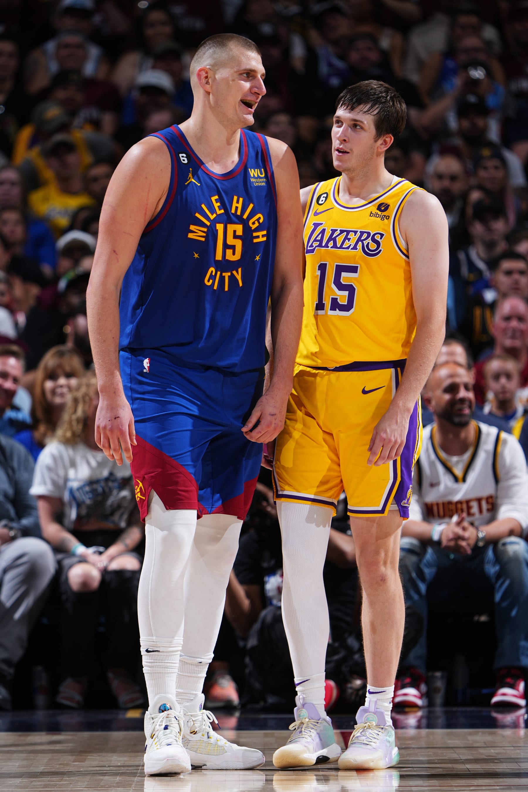 DENVER, CO -  MAY 16: Nikola Jokic #15 of the Denver Nuggets and Austin Reaves #15 of the Los Angeles Lakers look on during Round 3 Game 1 of the Western Conference Finals 2023 NBA Playoffs on May 16, 2023 at the Ball Arena in Denver, Colorado. NOTE TO USER: User expressly acknowledges and agrees that, by downloading and/or using this Photograph, user is consenting to the terms and conditions of the Getty Images License Agreement. Mandatory Copyright Notice: Copyright 2023 NBAE (Photo by Garrett Ellwood/NBAE via Getty Images)