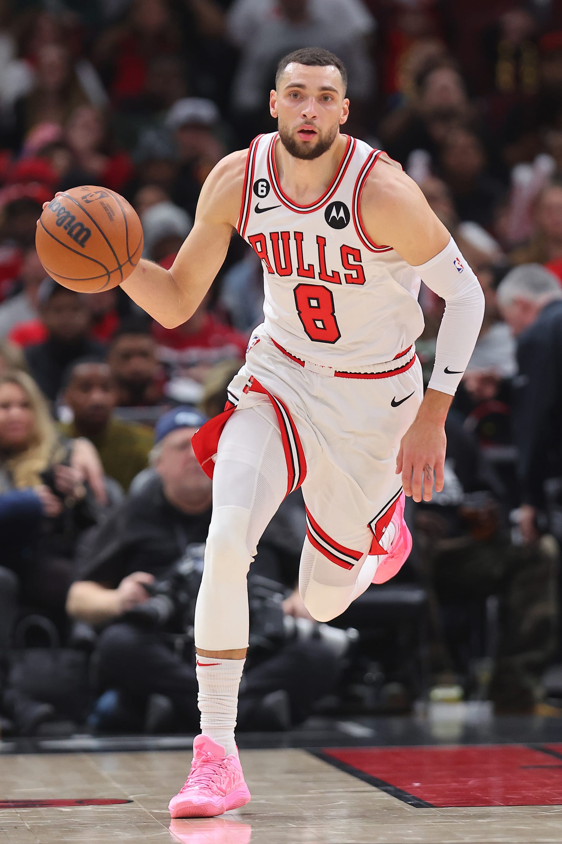 CHICAGO, ILLINOIS - DECEMBER 31: Zach LaVine #8 of the Chicago Bulls dribbles against the Cleveland Cavaliers during the first half at United Center on December 31, 2022 in Chicago, Illinois. NOTE TO USER: User expressly acknowledges and agrees that, by downloading and or using this photograph, User is consenting to the terms and conditions of the Getty Images License Agreement. (Photo by Michael Reaves/Getty Images)