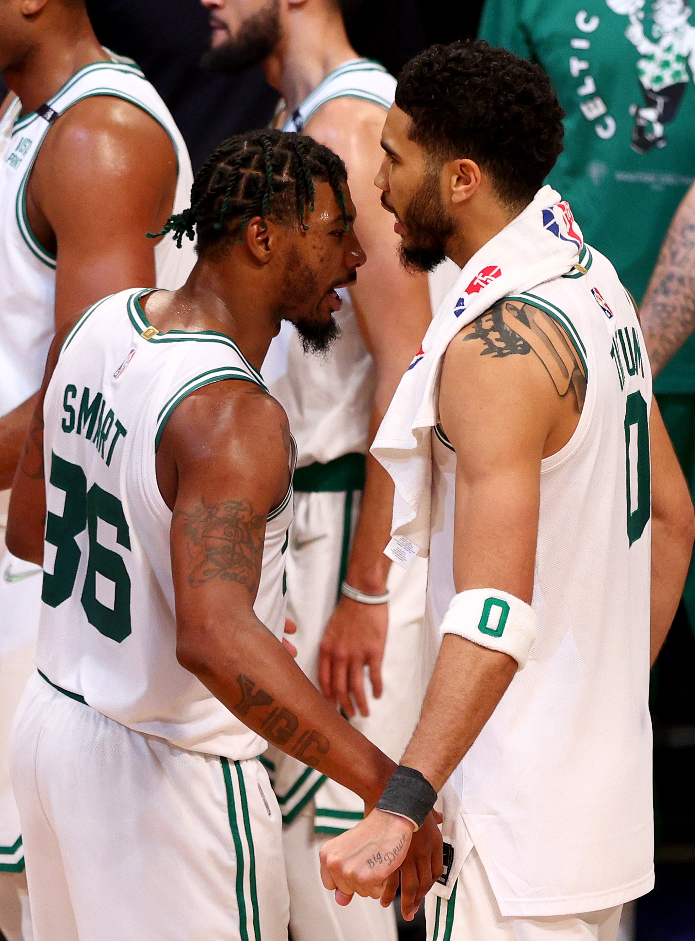 NEW YORK, NEW YORK - APRIL 25: Marcus Smart #36 and Jayson Tatum #0 of the Boston Celtics celebrates the win of Game Four of the Eastern Conference First Round Playoffs against the Boston Celtics at Barclays Center on April 25, 2022 in the Brooklyn borough of New York City. The Boston Celtics defeated the Brooklyn Nets 116-112. NOTE TO USER: User expressly acknowledges and agrees that, by downloading and or using this photograph, User is consenting to the terms and conditions of the Getty Images License Agreement. (Photo by Elsa/Getty Images)