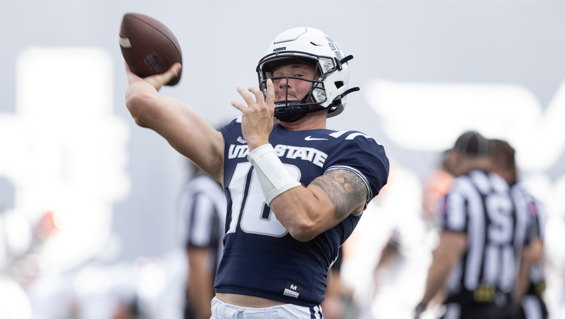 LOGAN, UT - SEPTEMBER 9: Levi Williams #16  of the Utah State Aggies throws a pass during warmups before their game against the Idaho State Bengals at Maverik Stadium September 9, 2023 in Logan, Utah. (Photo by Chris Gardner/Getty Images)