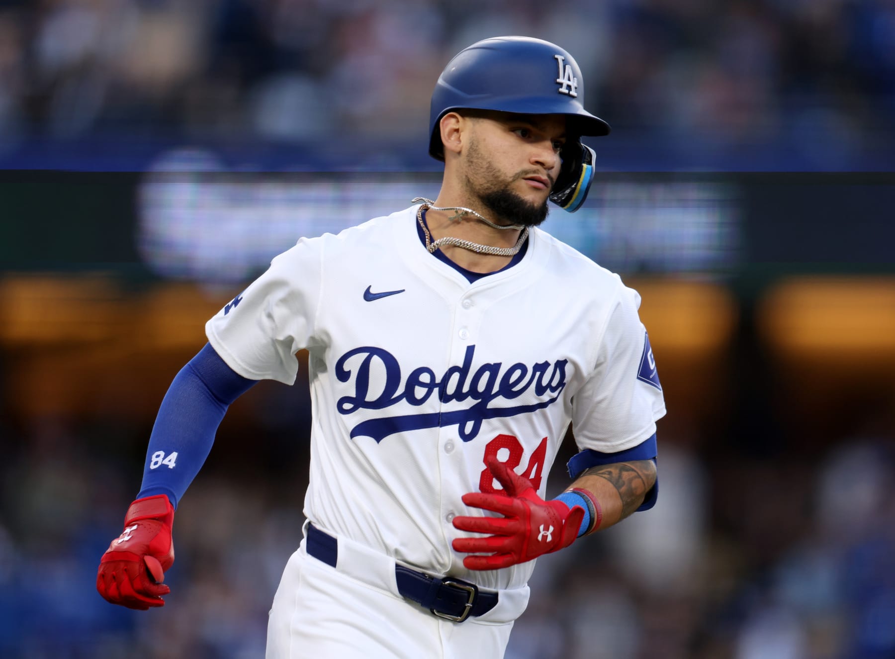 LOS ANGELES, CALIFORNIA - MAY 04: Andy Pages #84 of the Los Angeles Dodgers hits a solo home run, to take a 4-1 lead over the Atlanta Braves, during the fourth inning at Dodger Stadium on May 04, 2024 in Los Angeles, California. (Photo by Harry How/Getty Images)