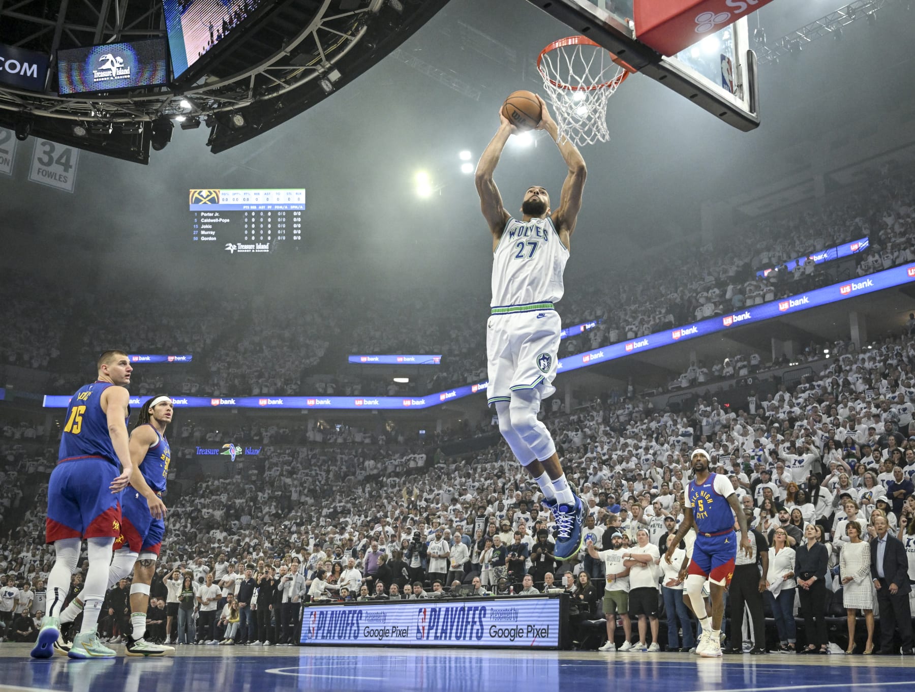 MINNEAPOLIS, MN - MAY 16: Rudy Gobert (27) of the Minnesota Timberwolves dunks as Nikola Jokic (15), Aaron Gordon (50) and Kentavious Caldwell-Pope (5) of the Denver Nuggets look on during the first quarter at Target Center in Minneapolis on Thursday, May 16, 2024. (Photo by AAron Ontiveroz/The Denver Post)