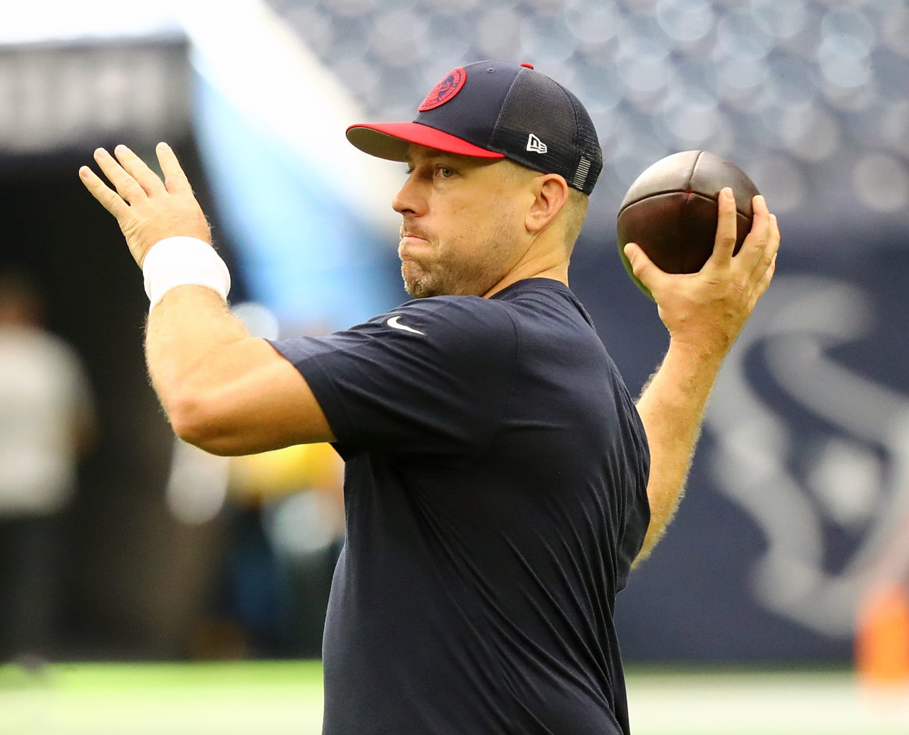 HOUSTON, TEXAS - SEPTEMBER 17: Case Keenum #18 of the Houston Texans warms up before a game against the Indianapolis Colts at NRG Stadium on September 17, 2023 in Houston, Texas. (Photo by Bob Levey/Getty Images)