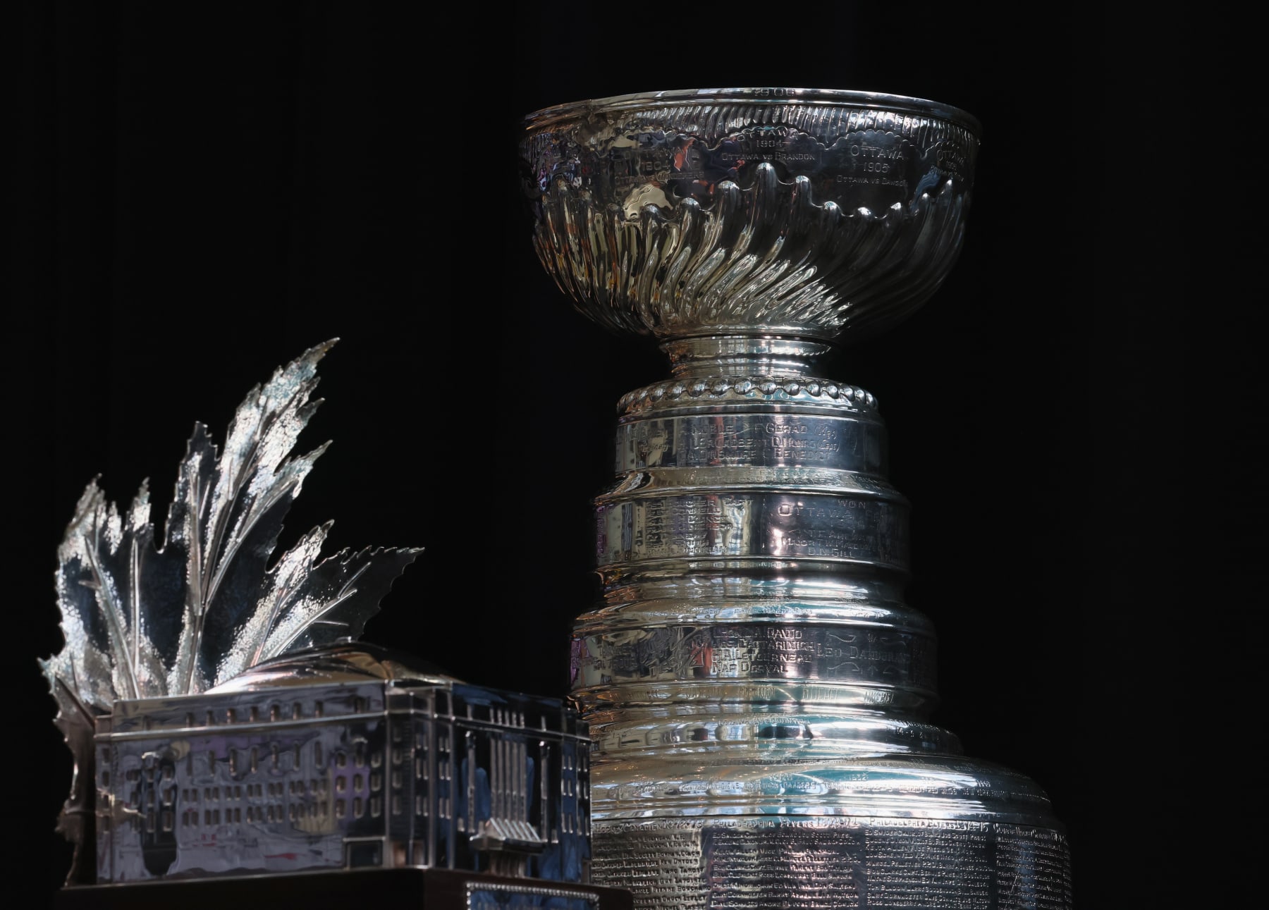 DENVER, COLORADO - JUNE 14: The Conn Smythe Trophy and the Stanley Cup are on display during the 2022 NHL Stanley Cup Final Media Day at Ball Arena on June 14, 2022 in Denver, Colorado. (Photo by Bruce Bennett/Getty Images)