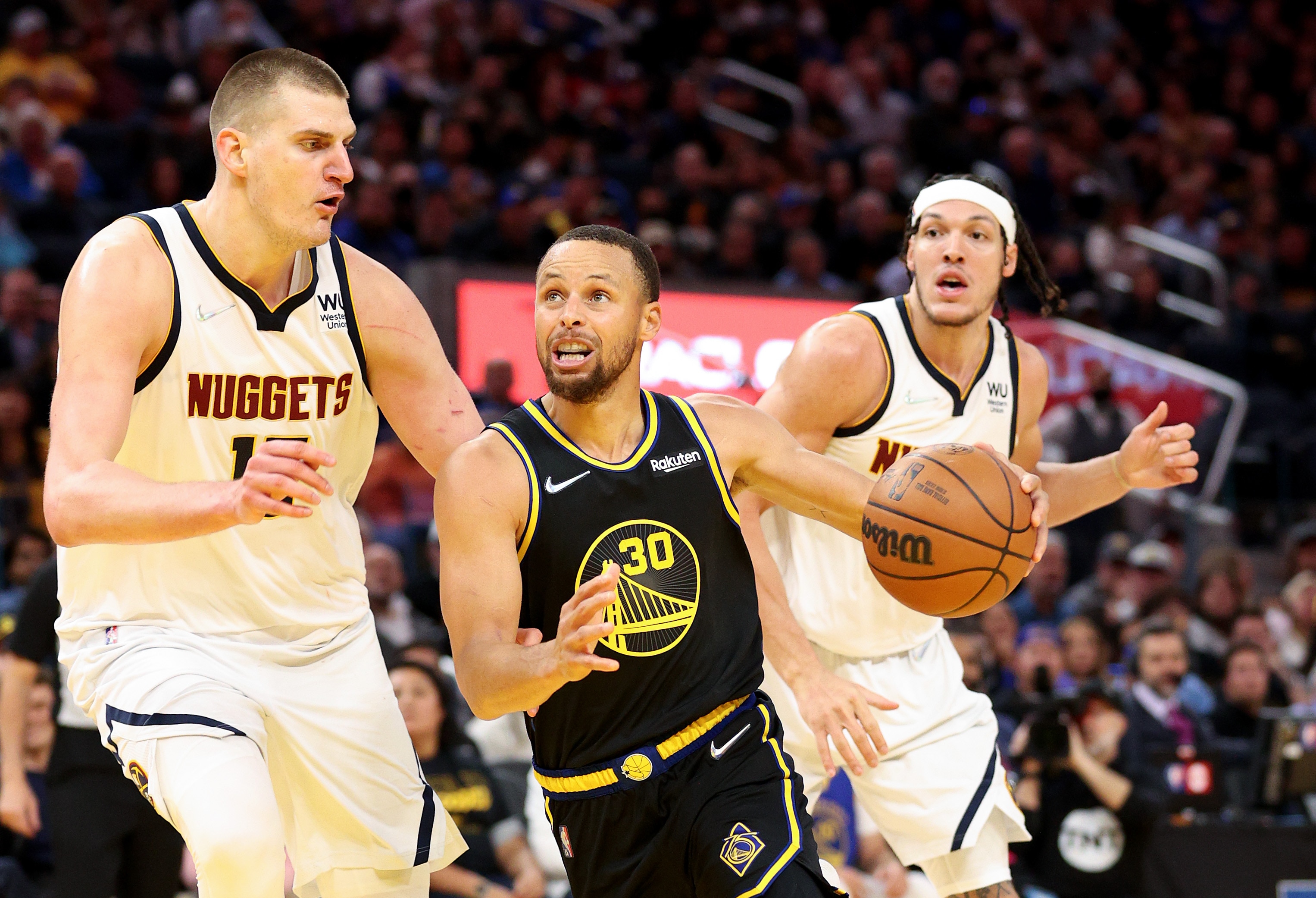 SAN FRANCISCO, CALIFORNIA - APRIL 27:  Stephen Curry #30 of the Golden State Warriors is guarded by Nikola Jokic #15 of the Denver Nuggets in the second half during Game Five of the Western Conference First Round NBA Playoffs at Chase Center on April 27, 2022 in San Francisco, California. NOTE TO USER: User expressly acknowledges and agrees that, by downloading and/or using this photograph, User is consenting to the terms and conditions of the Getty Images License Agreement.  (Photo by Ezra Shaw/Getty Images)