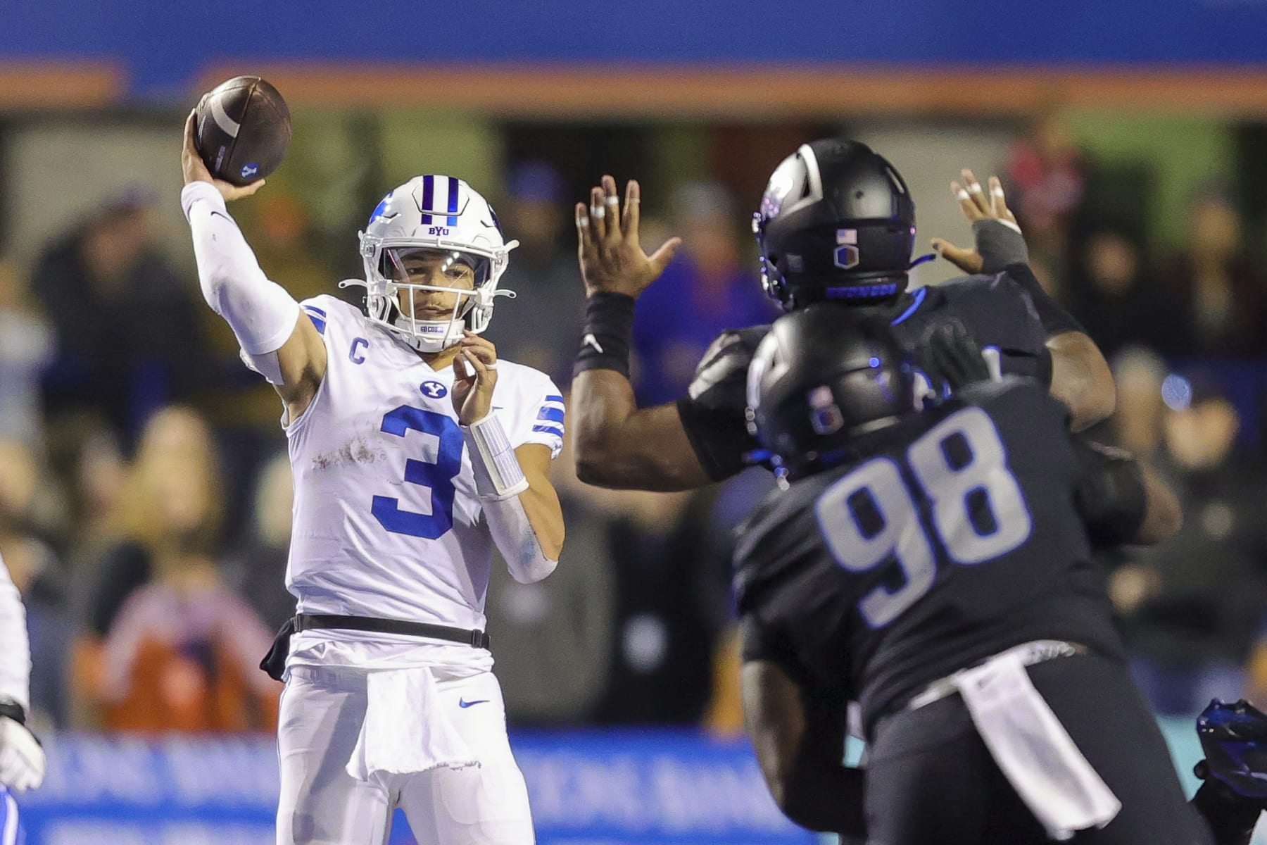BYU quarterback Jaren Hall (3) looks to throw under pressure from the Boise State defense in the second half of an NCAA college football game, Saturday, Nov. 5, 2022, in Boise, Idaho. (AP Photo/Steve Conner)