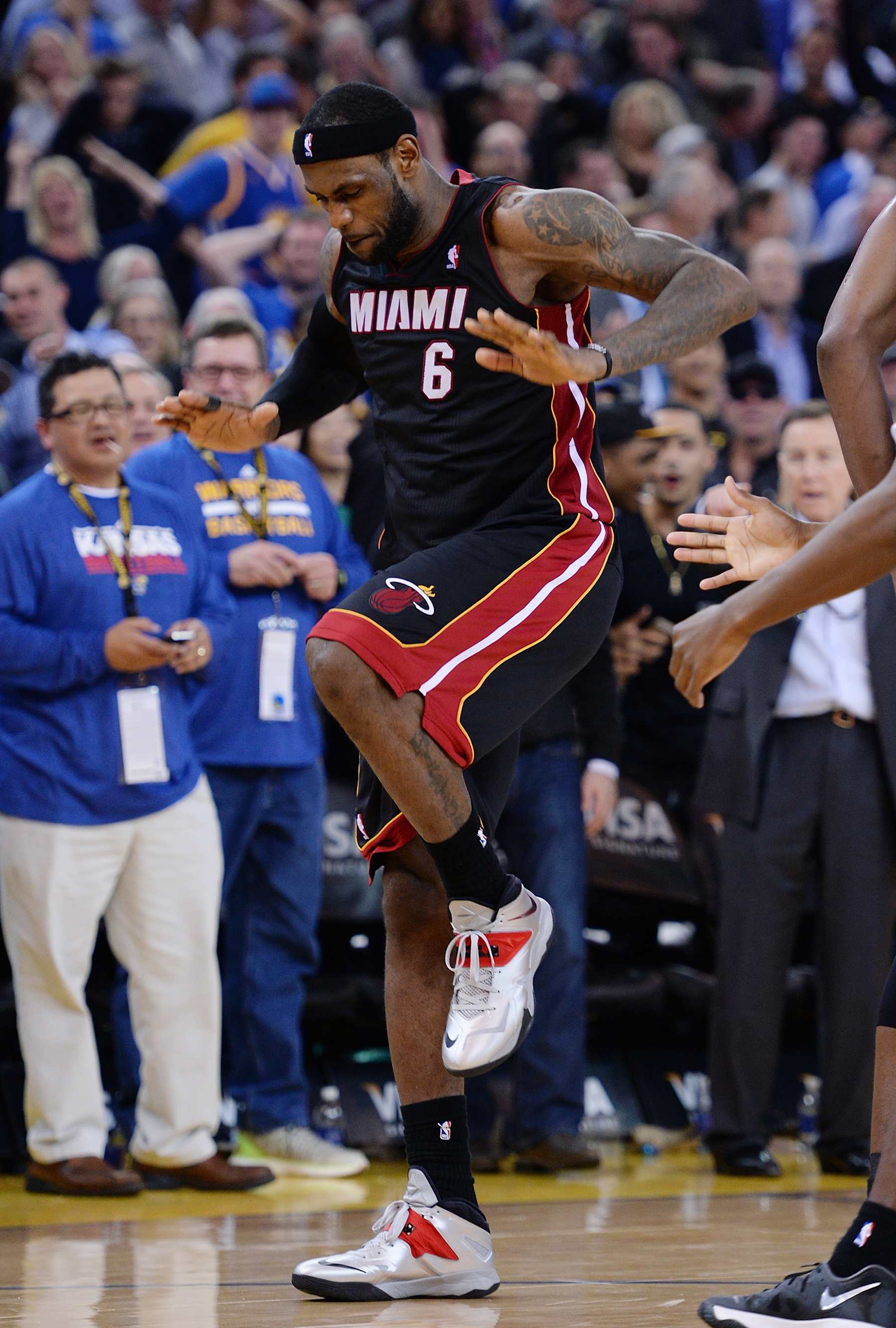 OAKLAND, CA - FEBRUARY 12:  LeBron James #6 of the Miami Heat celebrates after hitting a three-point shot to go ahead of the Golden State Warriors 111-110 and leaving less then 0.02 seconds on the clock in the fourth quarter at ORACLE Arena on February 12, 2014 in Oakland, California. NOTE TO USER: User expressly acknowledges and agrees that, by downloading and or using this photograph, User is consenting to the terms and conditions of the Getty Images License Agreement.  (Photo by Thearon W. Henderson/Getty Images) 