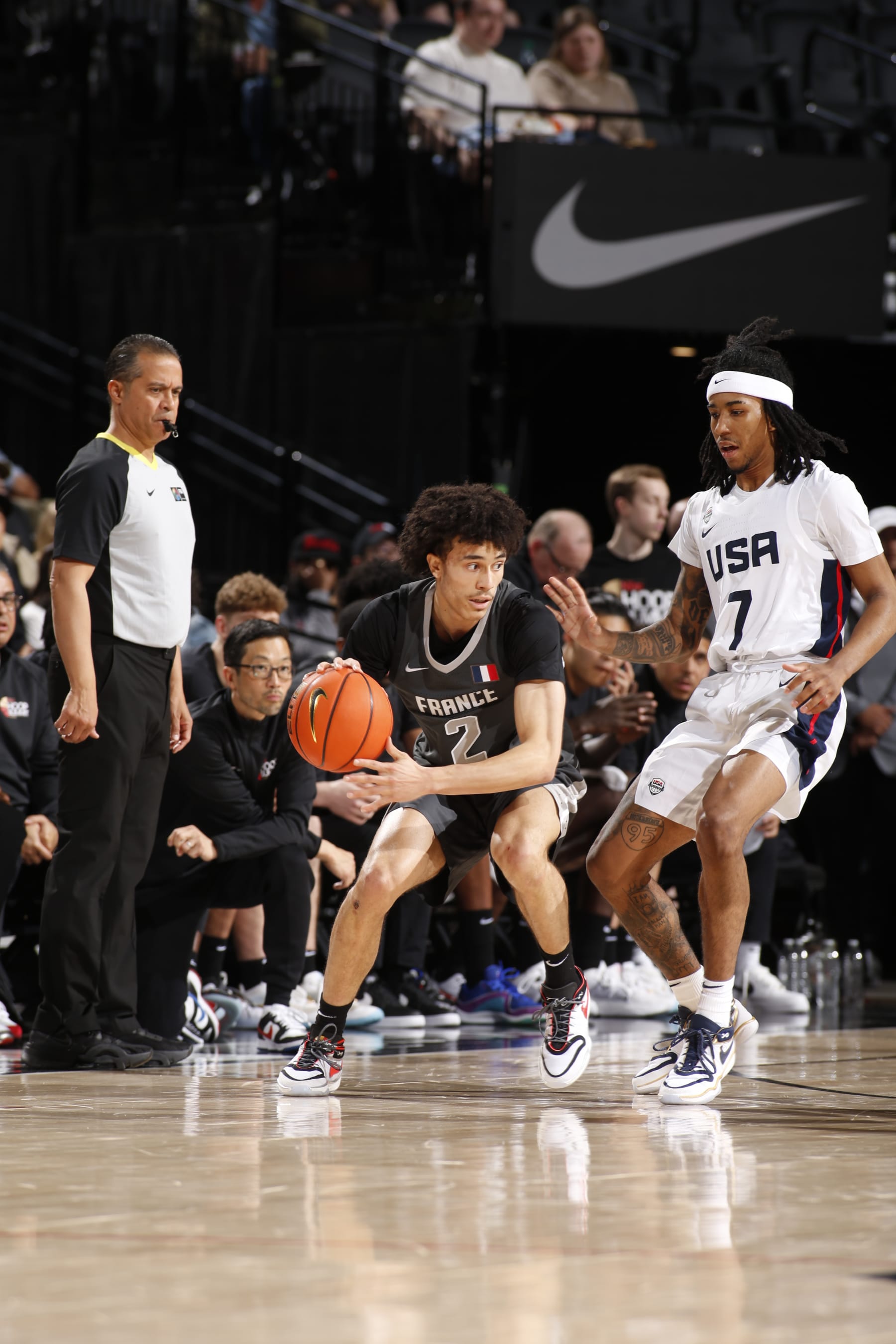 PORTLAND, OR - APRIL 13: Nolan Traore #2 of Team World handles the ball during the game against Team USA during the 2024 Nike Hoop Summit on April 13, 2024 at the Moda Center Arena in Portland, Oregon. NOTE TO USER: User expressly acknowledges and agrees that, by downloading and or using this photograph, user is consenting to the terms and conditions of the Getty Images License Agreement. Mandatory Copyright Notice: Copyright 2024 NBAE (Photo by Cameron Browne/NBAE via Getty Images)