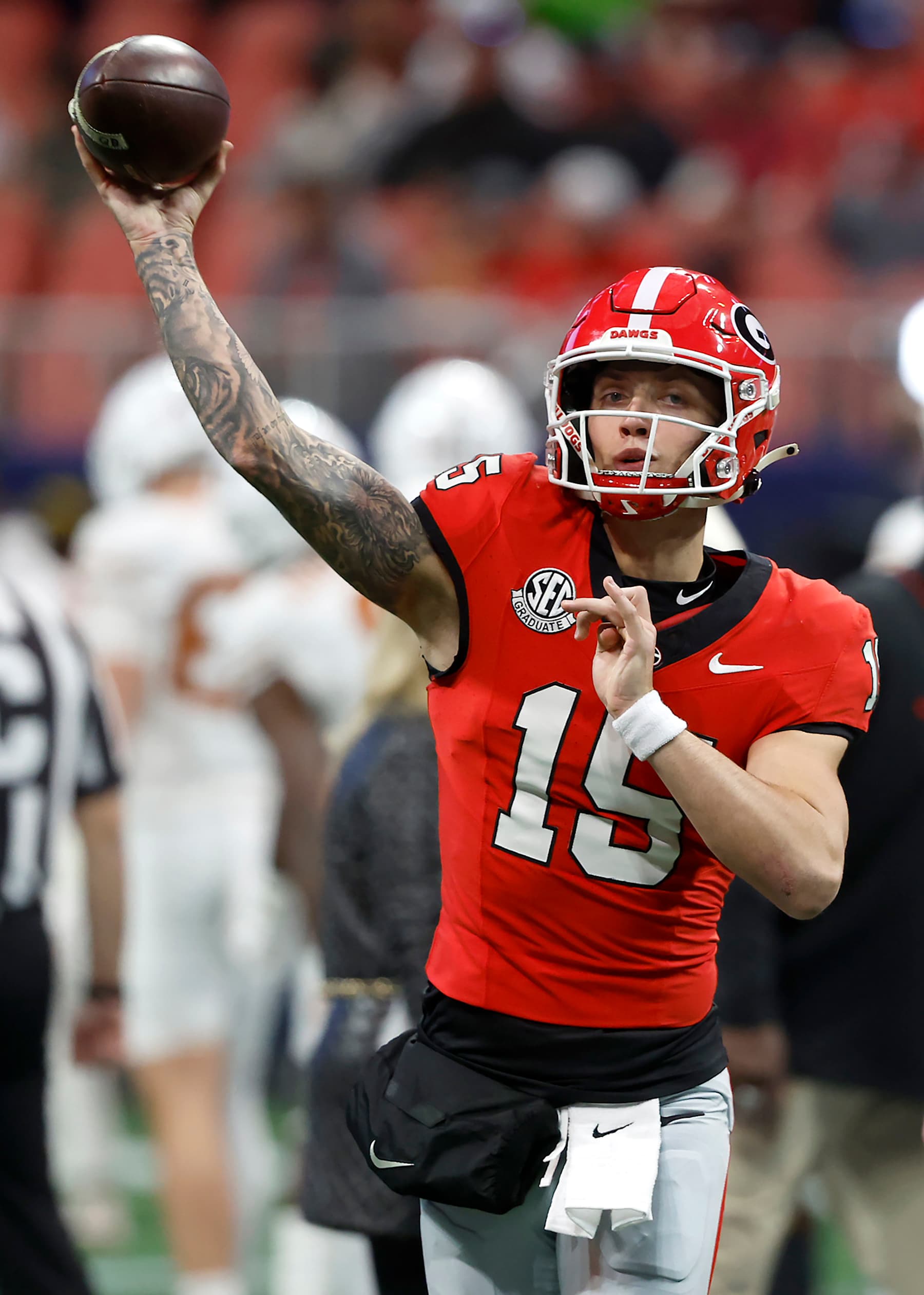 ATLANTA, GEORGIA - DECEMBER 07: Carson Beck #15 of the Georgia Bulldogs warms up prior to the 2024 SEC Championship against the Texas Longhorns at Mercedes-Benz Stadium on December 07, 2024 in Atlanta, Georgia. (Photo by Butch Dill/Getty Images)