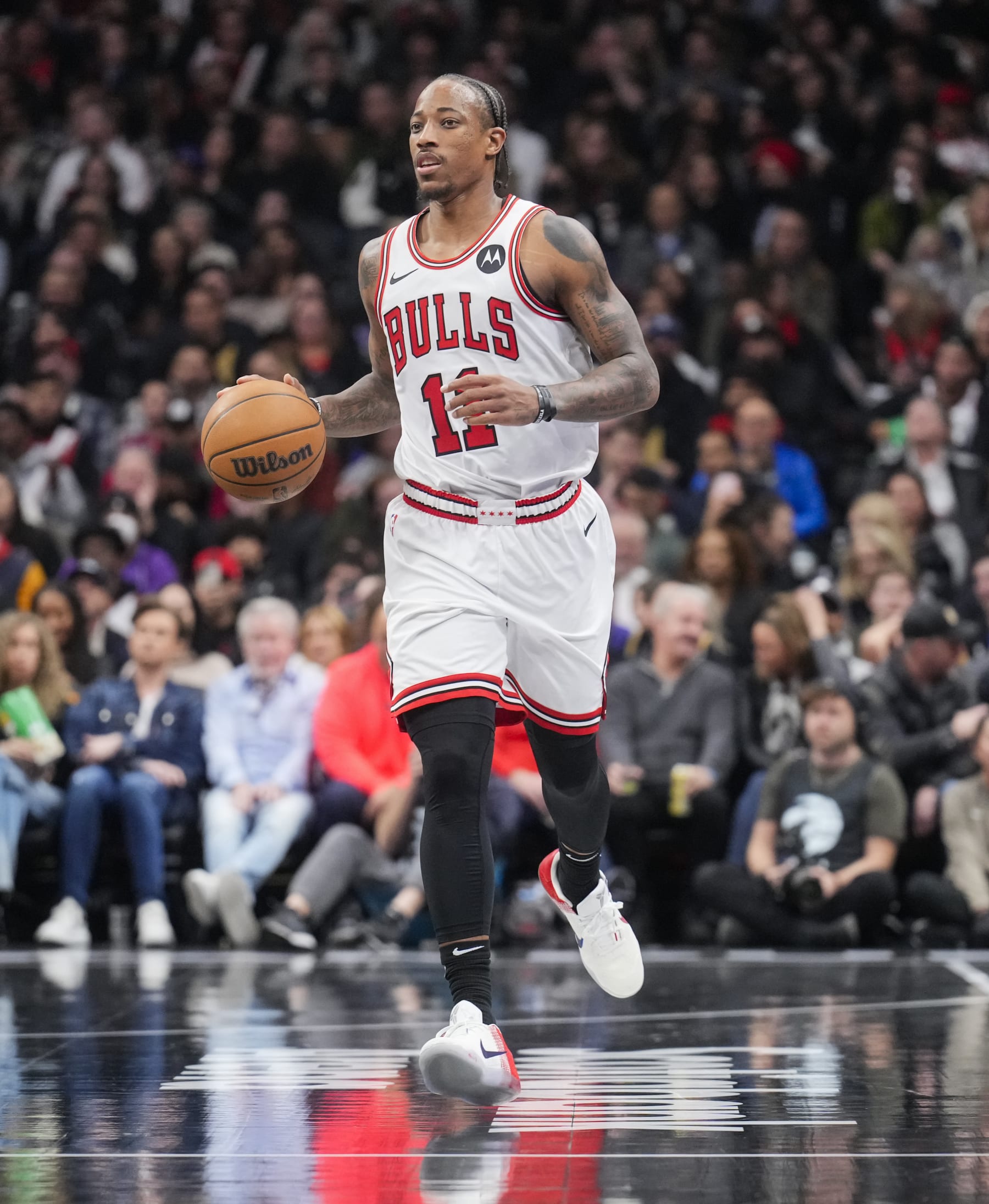 TORONTO, ON - NOVEMBER 24: DeMar DeRozan #11 of the Chicago Bulls dribbles against the Toronto Raptors during the second half of their NBA In-Season Tournament game at the Scotiabank Arena on November 24, 2023 in Toronto, Ontario, Canada. NOTE TO USER: User expressly acknowledges and agrees that, by downloading and/or using this Photograph, user is consenting to the terms and conditions of the Getty Images License Agreement. (Photo by Mark Blinch/Getty Images)