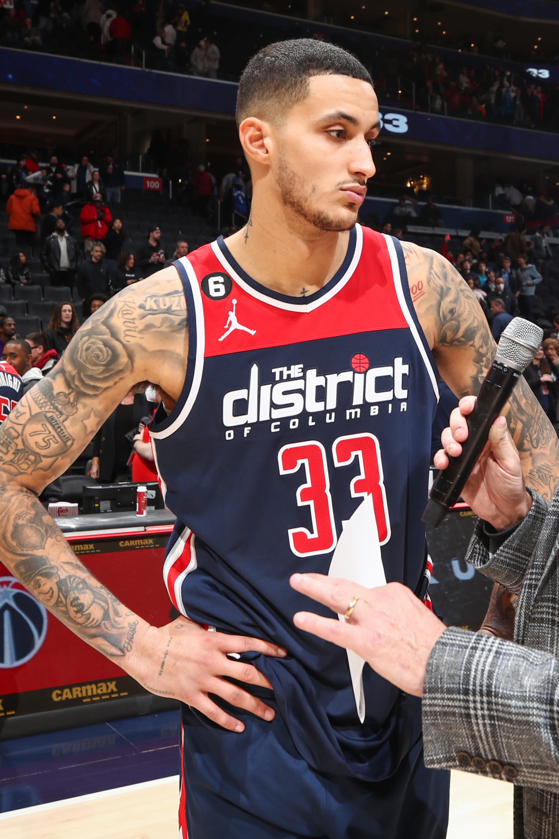 WASHINGTON, DC -  JANUARY 21:  Kyle Kuzma #33 of the Washington Wizards talks to the media after the game against the Orlando Magic on January 21, 2023 at Capital One Arena in Washington, DC. NOTE TO USER: User expressly acknowledges and agrees that, by downloading and or using this Photograph, user is consenting to the terms and conditions of the Getty Images License Agreement. Mandatory Copyright Notice: Copyright 2023 NBAE (Photo by KeShawn Ennis /NBAE via Getty Images)