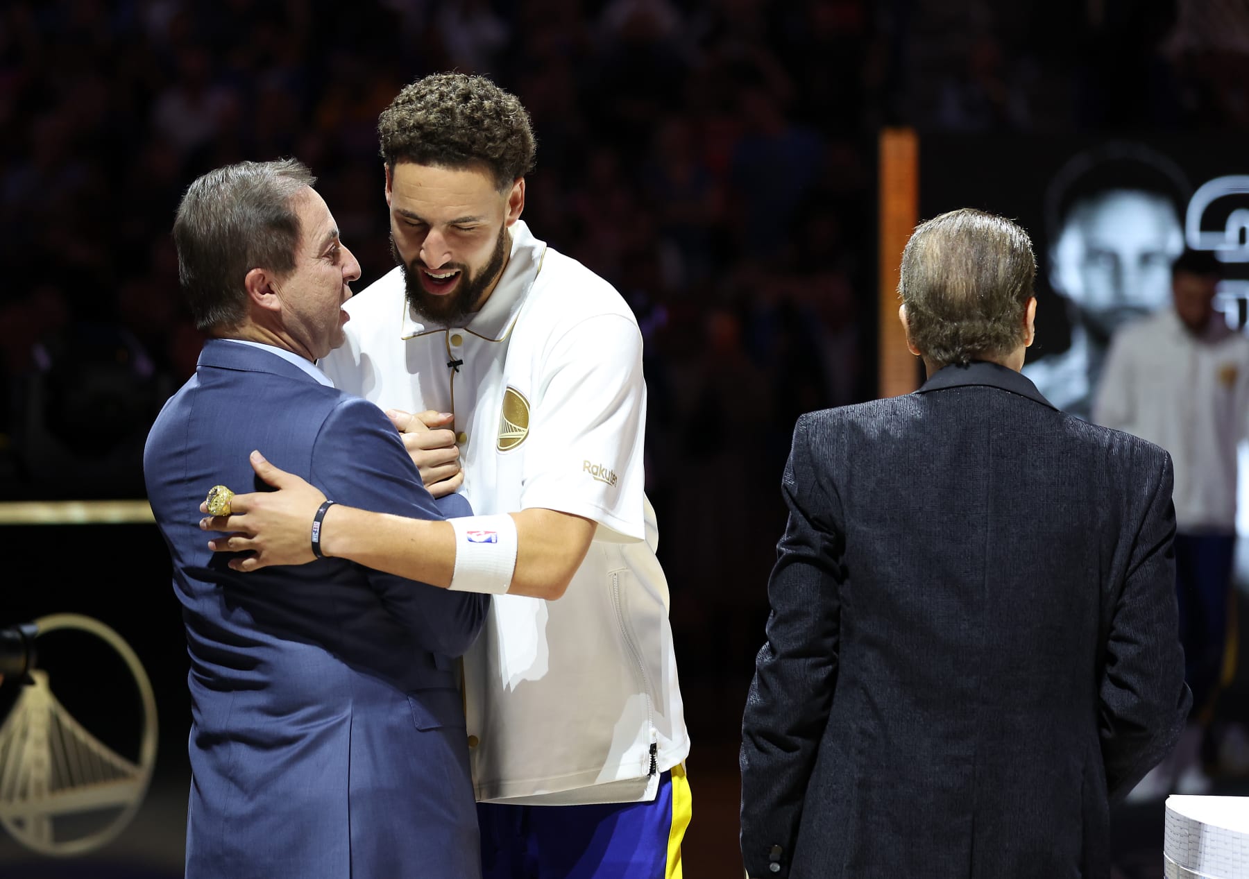 SAN FRANCISCO, CALIFORNIA - OCTOBER 18:  Klay Thompson #11of the Golden State Warriors receives his Championship ring from team owners Joe Lacob and Peter Guber during a ceremony prior to the game against the Los Angeles Lakers at Chase Center on October 18, 2022 in San Francisco, California. NOTE TO USER: User expressly acknowledges and agrees that, by downloading and or using this photograph, User is consenting to the terms and conditions of the Getty Images License Agreement. (Photo by Ezra Shaw/Getty Images)