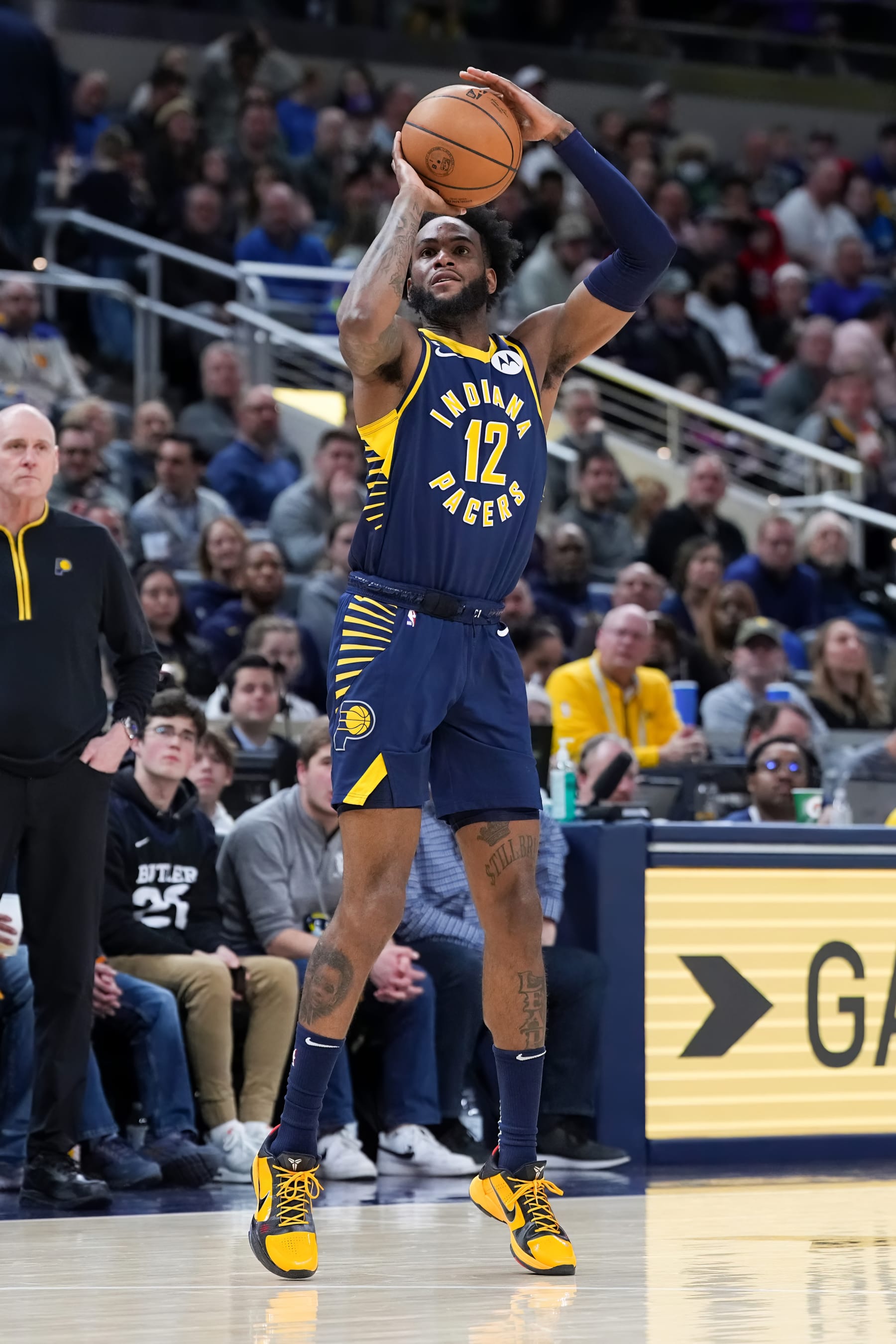 INDIANAPOLIS, INDIANA - MARCH 29: Oshae Brissett #12 of the Indiana Pacers attempts a shot in the fourth quarter against the Milwaukee Bucks at Gainbridge Fieldhouse on March 29, 2023 in Indianapolis, Indiana. NOTE TO USER: User expressly acknowledges and agrees that, by downloading and or using this photograph, User is consenting to the terms and conditions of the Getty Images License Agreement. (Photo by Dylan Buell/Getty Images)