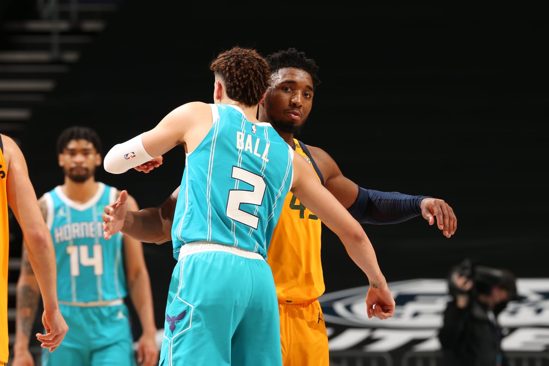 CHARLOTTE, NC - FEBRUARY 5: LaMelo Ball #2 of the Charlotte Hornets and Donovan Mitchell #45 of the Utah Jazz hug after the game on February 5, 2021 at Spectrum Center in Charlotte, North Carolina. NOTE TO USER: User expressly acknowledges and agrees that, by downloading and or using this photograph, User is consenting to the terms and conditions of the Getty Images License Agreement. Mandatory Copyright Notice: Copyright 2021 NBAE (Photo by Kent Smith/NBAE via Getty Images)