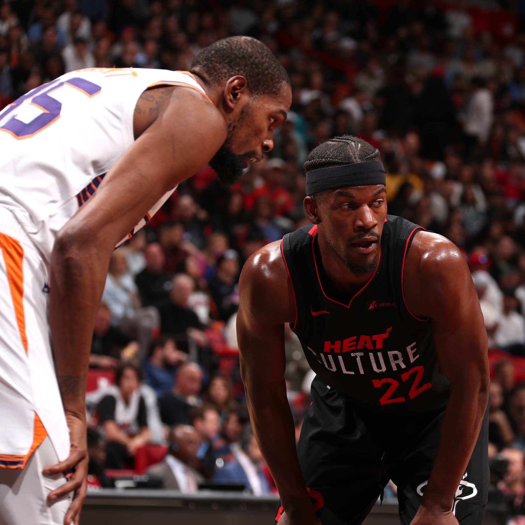 MIAMI, FL - JANUARY 29: Kevin Durant #35 of the Phoenix Suns and Jimmy Butler #22 of the Miami Heat look on during the game on January 29, 2024 at Kaseya Center in Miami, Florida. NOTE TO USER: User expressly acknowledges and agrees that, by downloading and or using this Photograph, user is consenting to the terms and conditions of the Getty Images License Agreement. Mandatory Copyright Notice: Copyright 2024 NBAE (Photo by Issac Baldizon/NBAE via Getty Images)