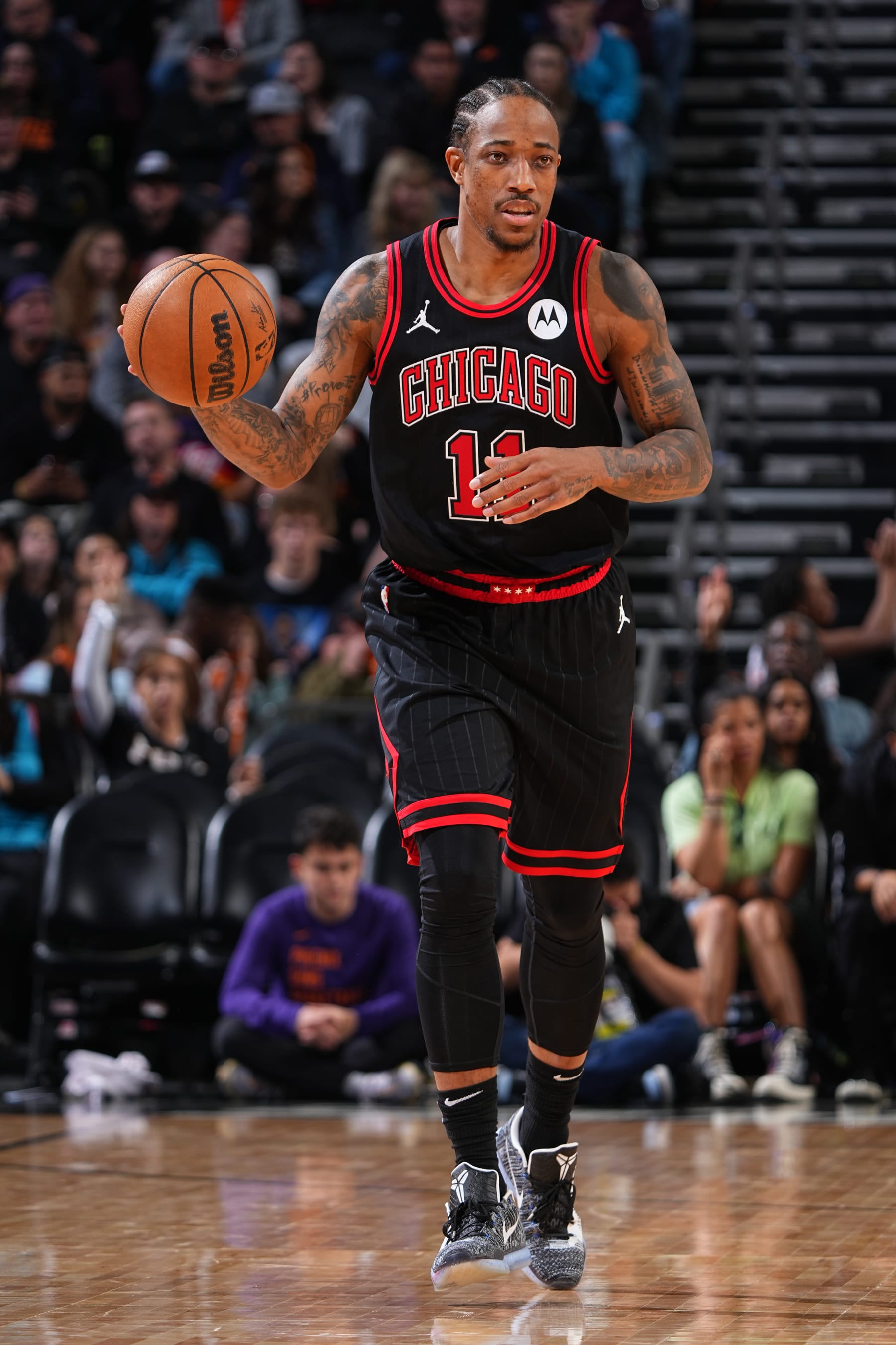 PHOENIX, AZ - JANUARY 22: DeMar DeRozan #11 of the Chicago Bulls dribbles the ball during the game against the Phoenix Suns on January 22, 2024 at Footprint Center in Phoenix, Arizona. NOTE TO USER: User expressly acknowledges and agrees that, by downloading and or using this photograph, user is consenting to the terms and conditions of the Getty Images License Agreement. Mandatory Copyright Notice: Copyright 2024 NBAE (Photo by Garrett Ellwood/NBAE via Getty Images)