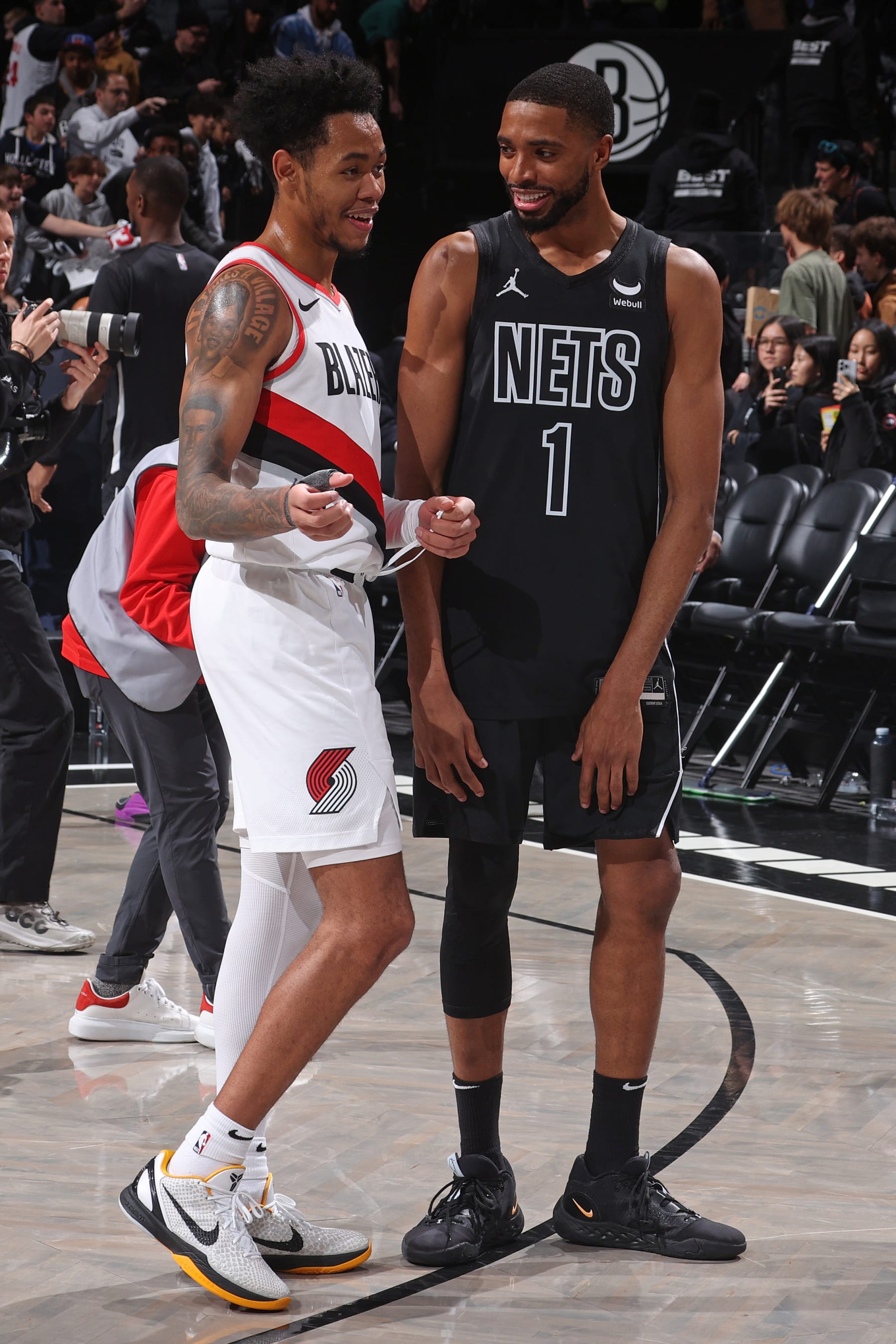 BROOKLYN, NY - JANUARY 7: Anfernee Simons #1 of the Portland Trail Blazers and Mikal Bridges #1 of the Brooklyn Nets talk after the game on January 7, 2024 at Barclays Center in Brooklyn, New York. NOTE TO USER: User expressly acknowledges and agrees that, by downloading and or using this Photograph, user is consenting to the terms and conditions of the Getty Images License Agreement. Mandatory Copyright Notice: Copyright 2024 NBAE (Photo by Nathaniel S. Butler/NBAE via Getty Images)